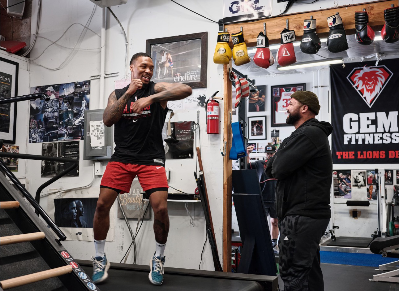 NBA All-Star Damian Lillard, aka "Dame Dolla," with pro boxing trainer Cem Eren, aka "The Lion," inside the Lion’s Den training facility where elite athletes train for peak performance.