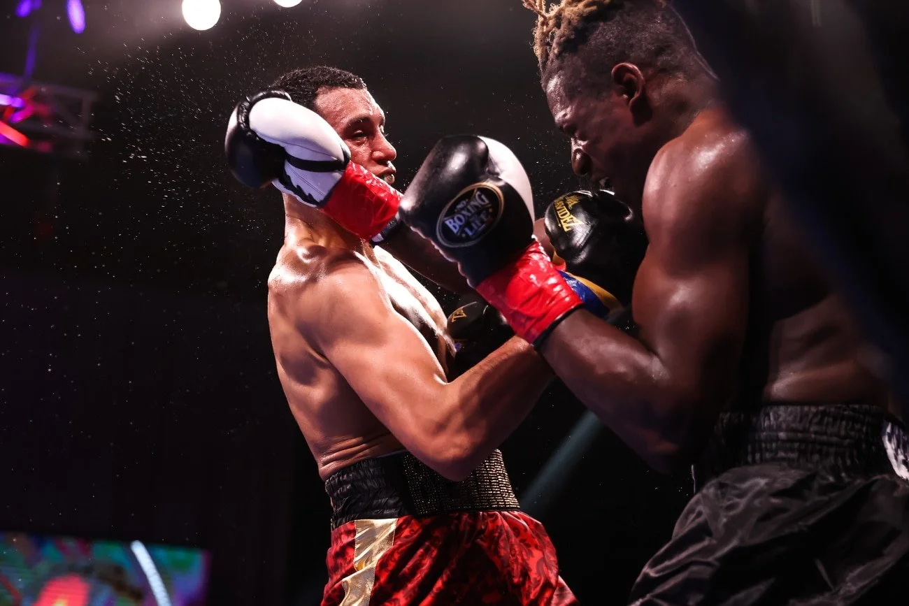 David Benavidez, known as "The Mexican Monster," trades punches with an opponent during a high-intensity professional boxing match—elite boxing action, combat sports, pro athlete performance.