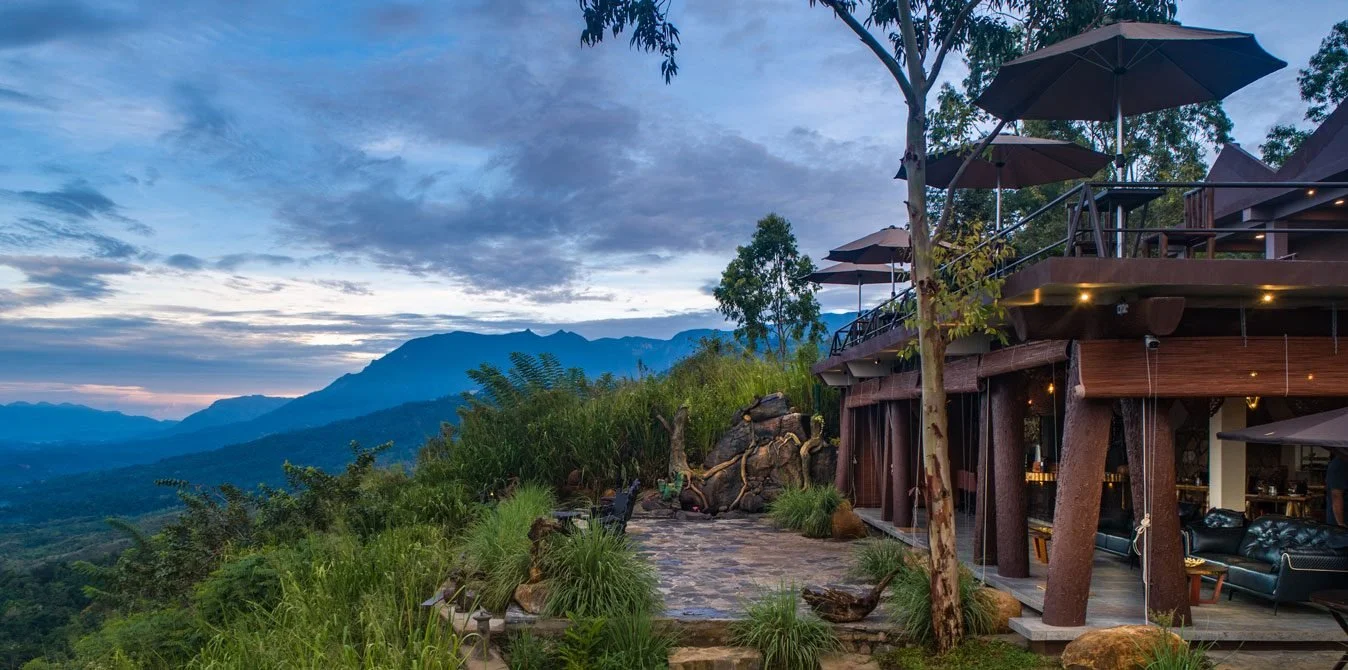 Dream Cliff Mountain Resort on a hillside, with layered mountains and valleys behind