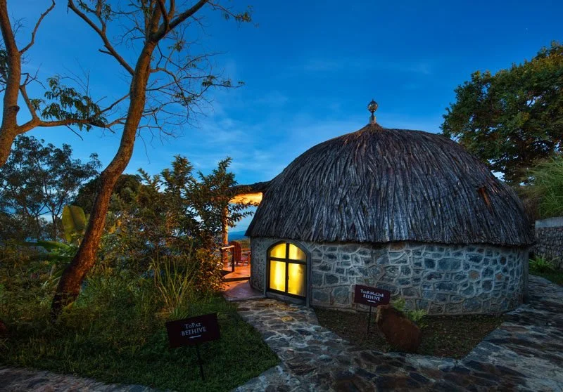 A domed Beehive cabana at Dream Cliff, lit at dusk
