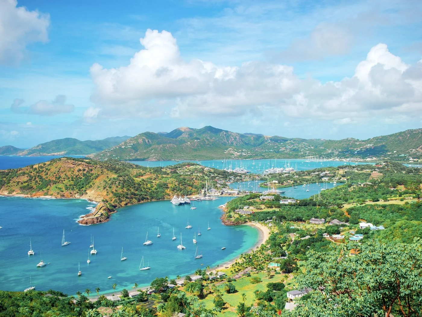 English Harbour and Falmouth Harbour in Antigua seen from Shirley Heights, dotted with yachts