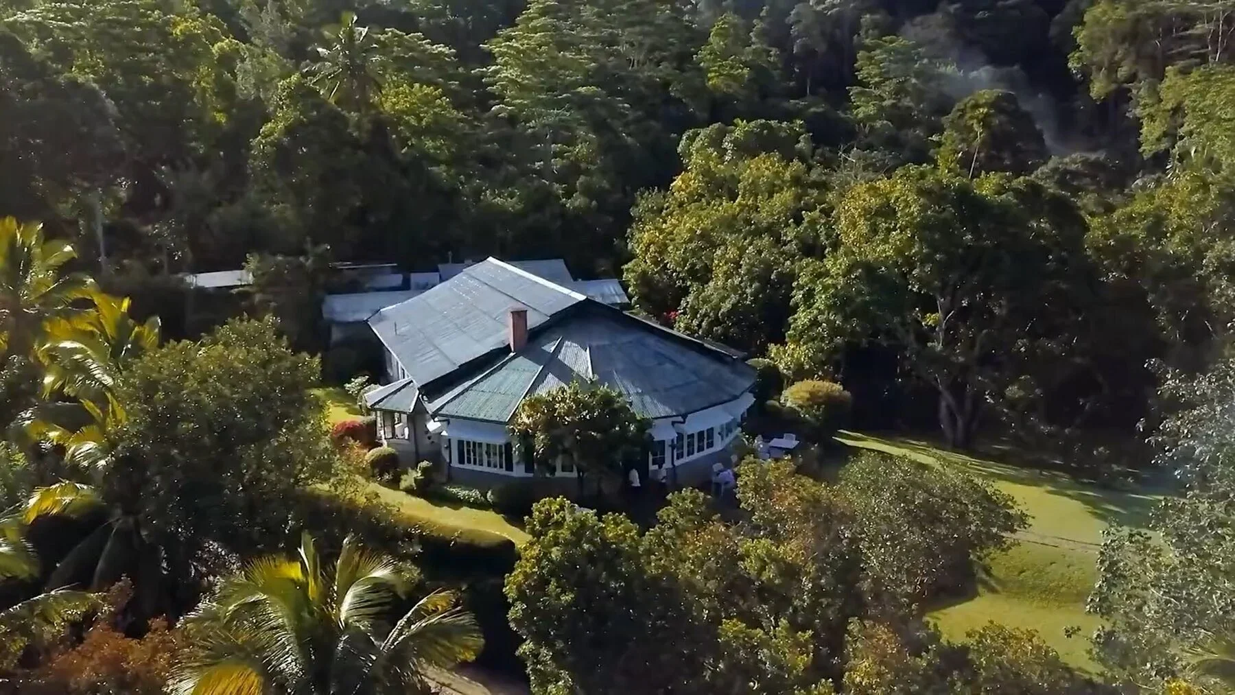 Mountbatten Bungalow, a white colonial bungalow surrounded by gardens and forested hills above Kandy