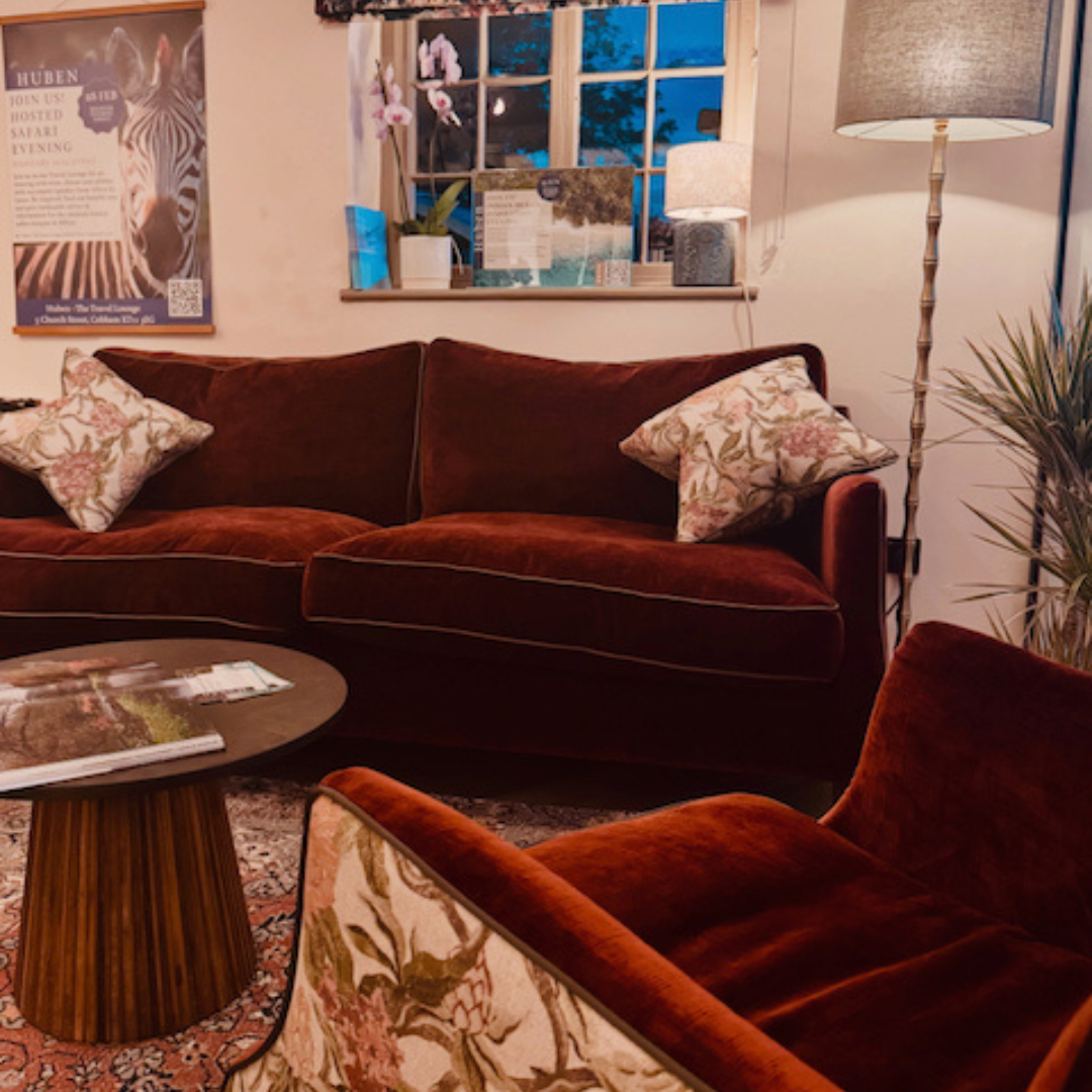 Velvet sofas and armchairs inside The Travel Lounge in Cobham