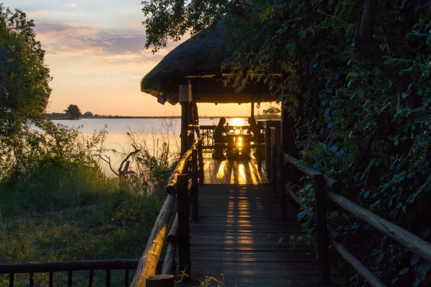 The jetty at Sedudu Bar at sunset on the Chobe River