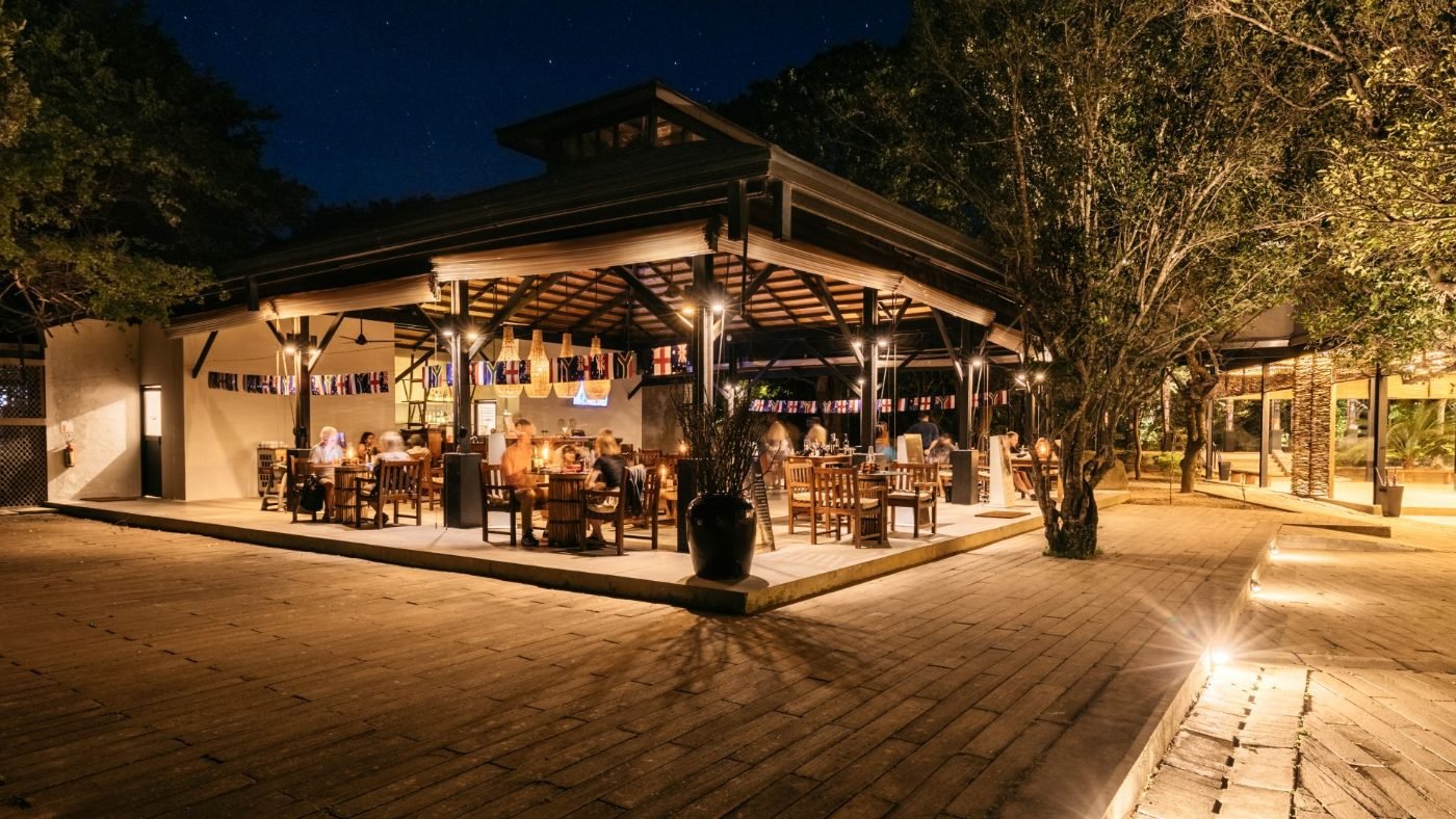 Tuskers restaurant at Cinnamon Wild Yala, lit up in the evening