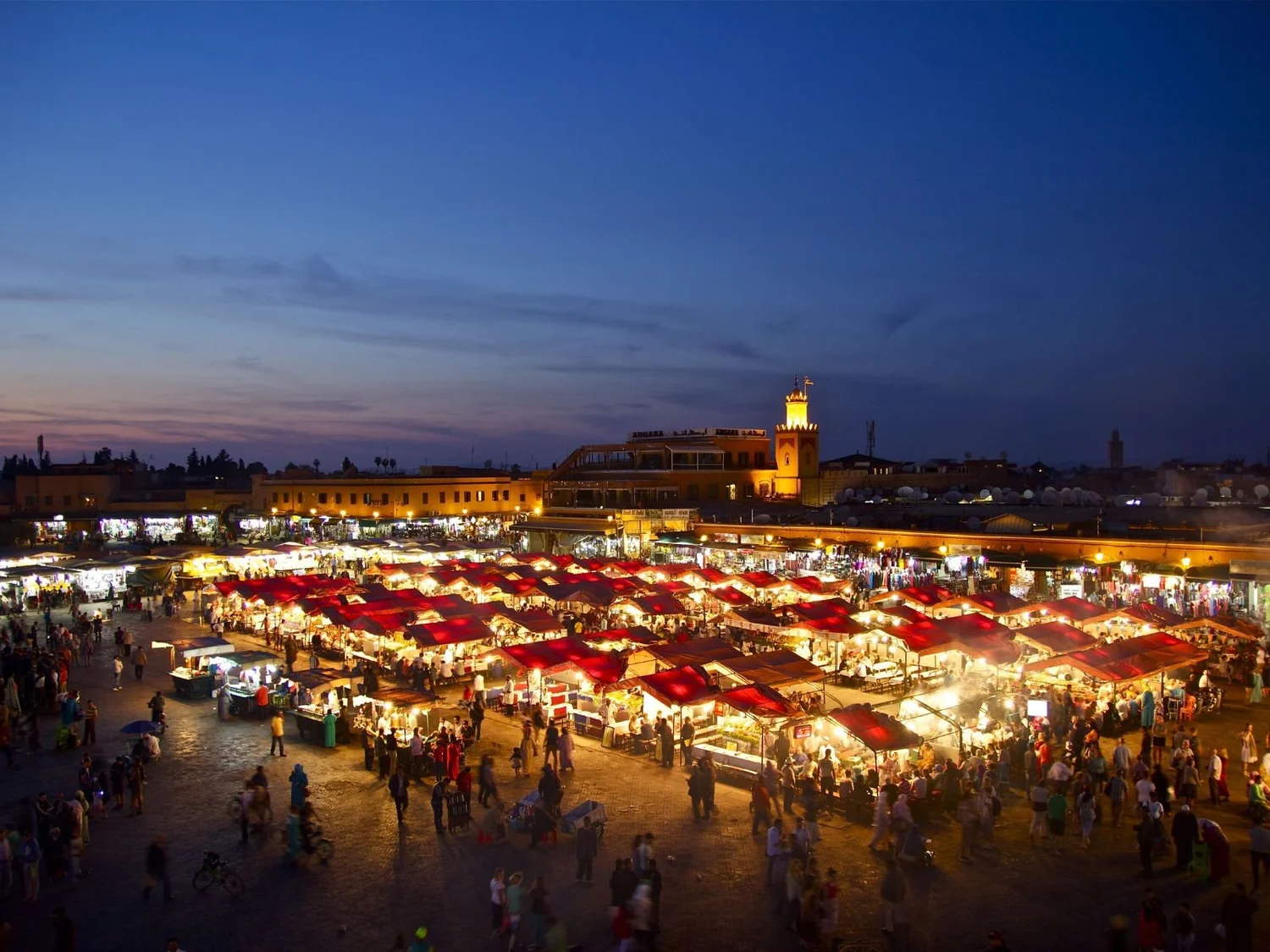 Food stalls lit up at dusk in Jemaa el-Fnaa square, Marrakech