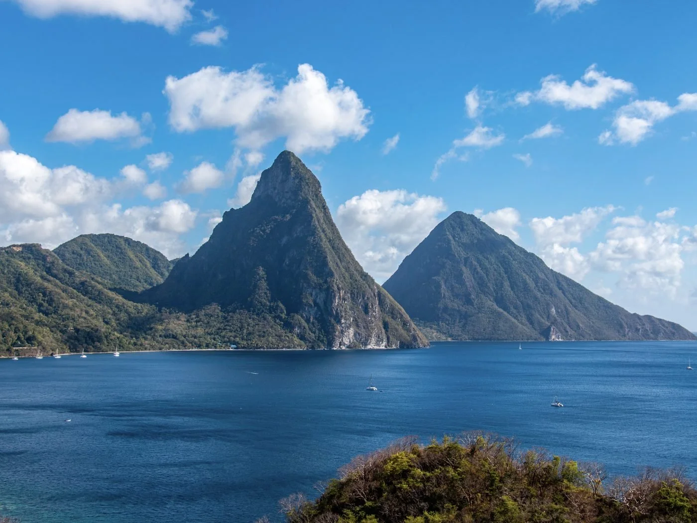 The Pitons rising above a sheltered bay on the coast of St Lucia