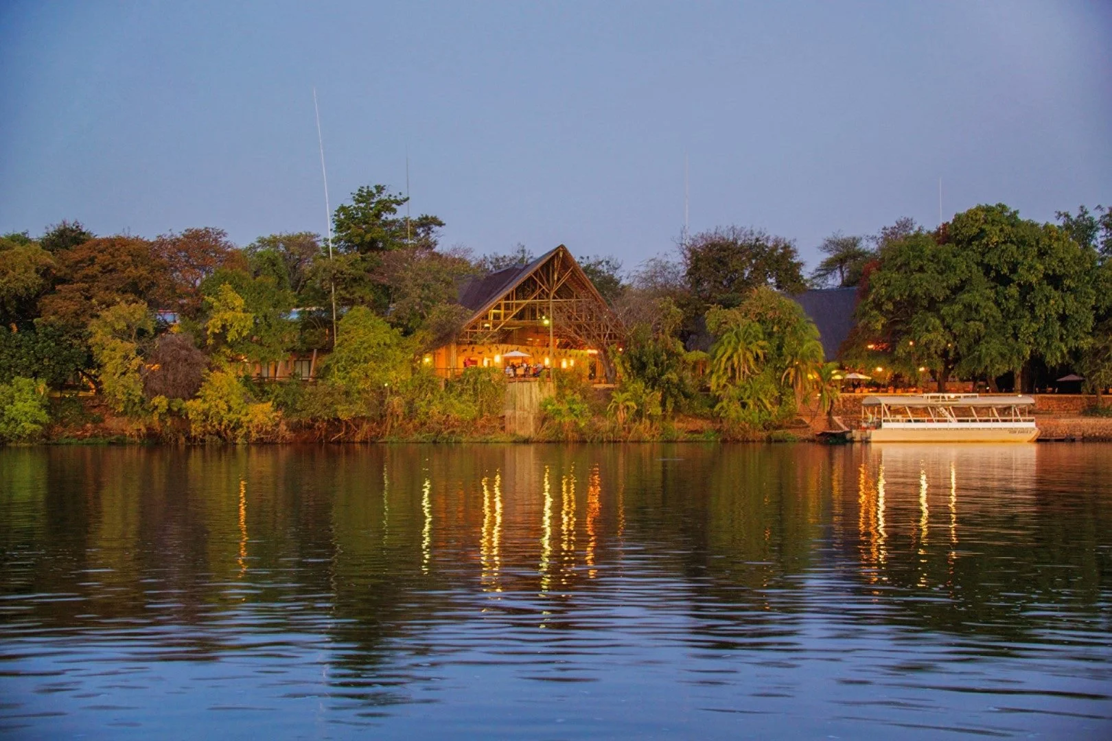 Chobe Safari Lodge seen from the Chobe River at dusk