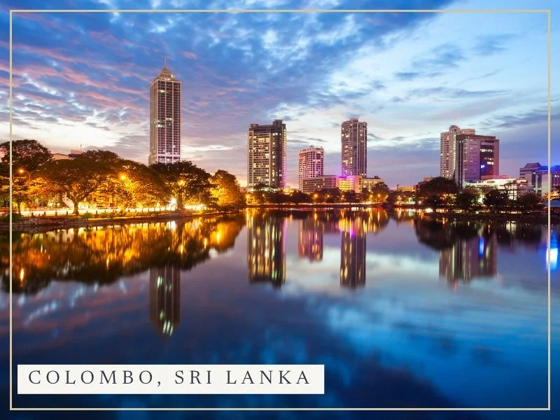 Colombo's skyline reflected in Beira Lake at dusk