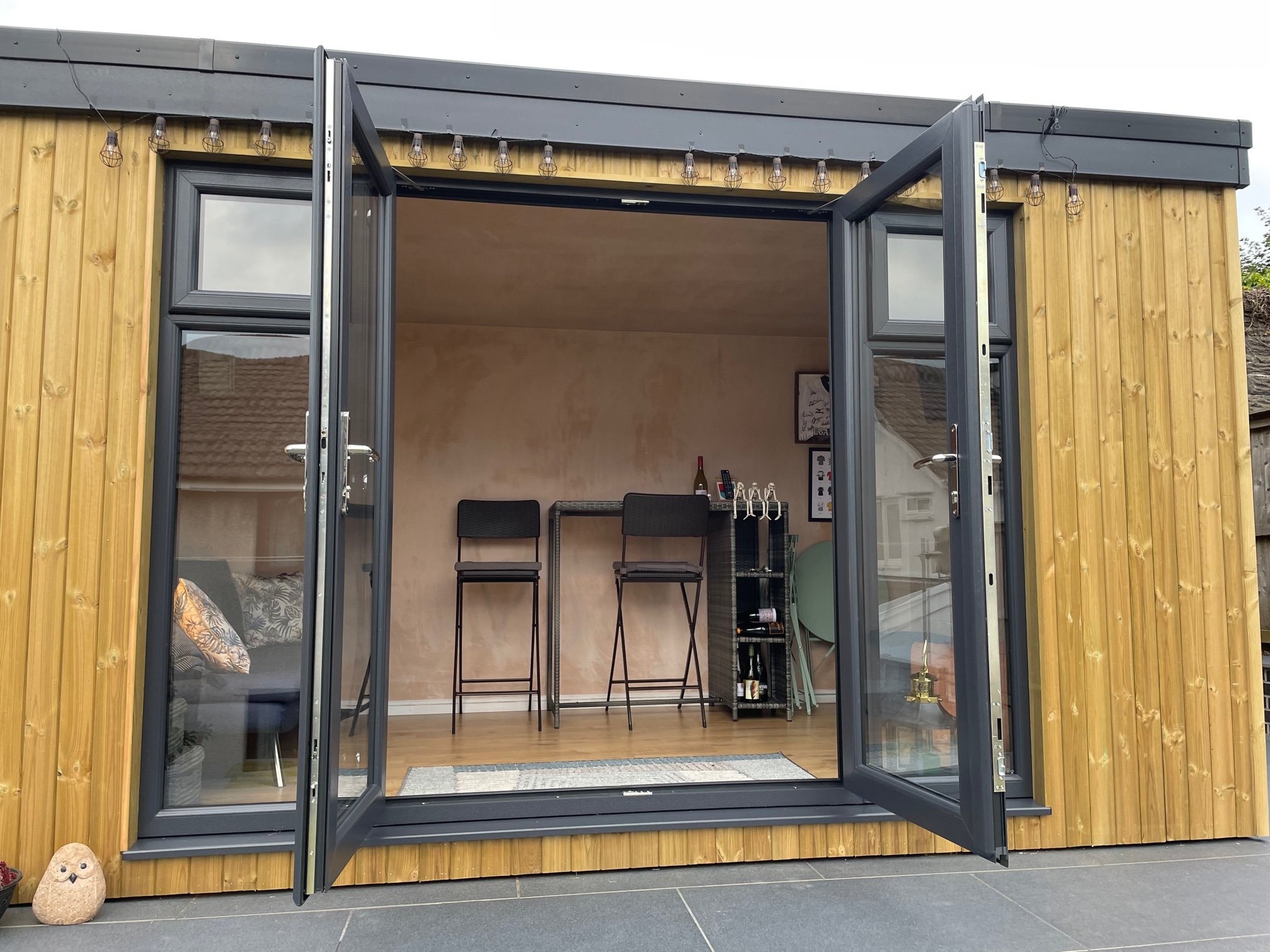  Enjoy the outdoors while working in this garden office with sliding doors. 
