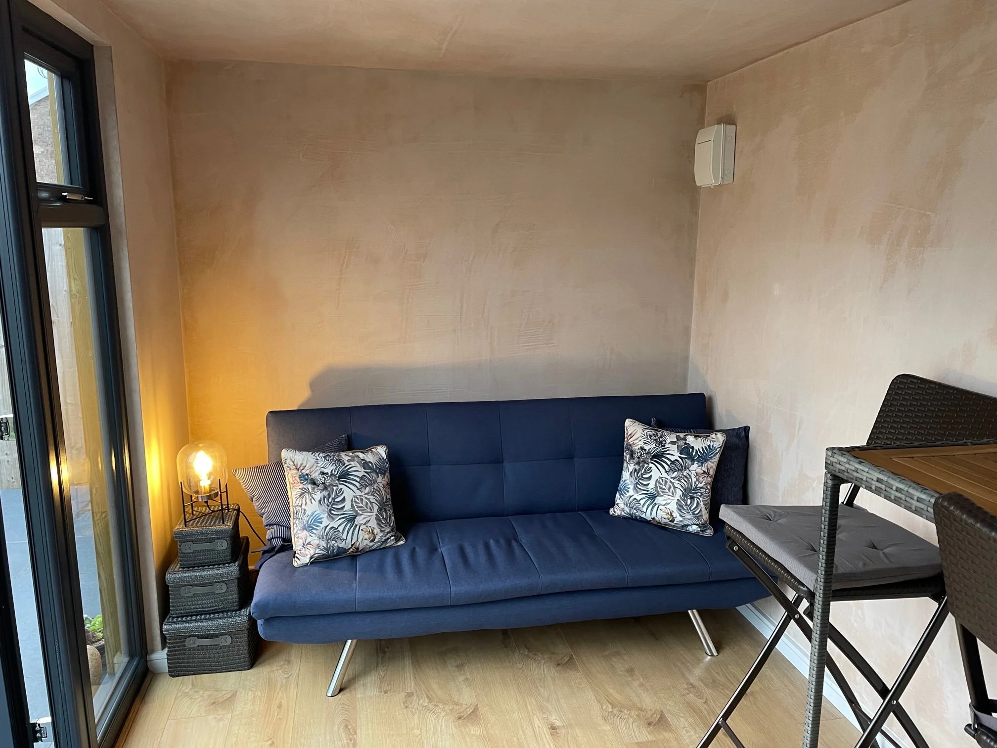  Comfortable living room featuring a bean bag and table. 