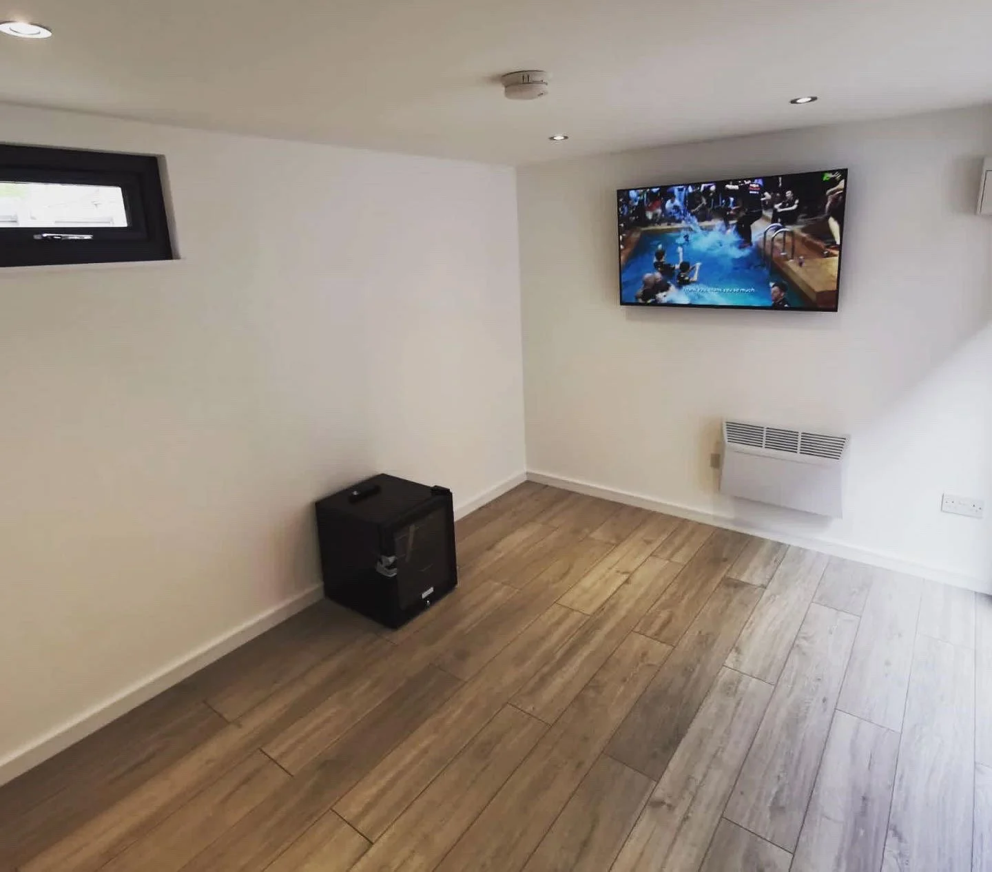  Modern outdoor living room with TV on wall. 
