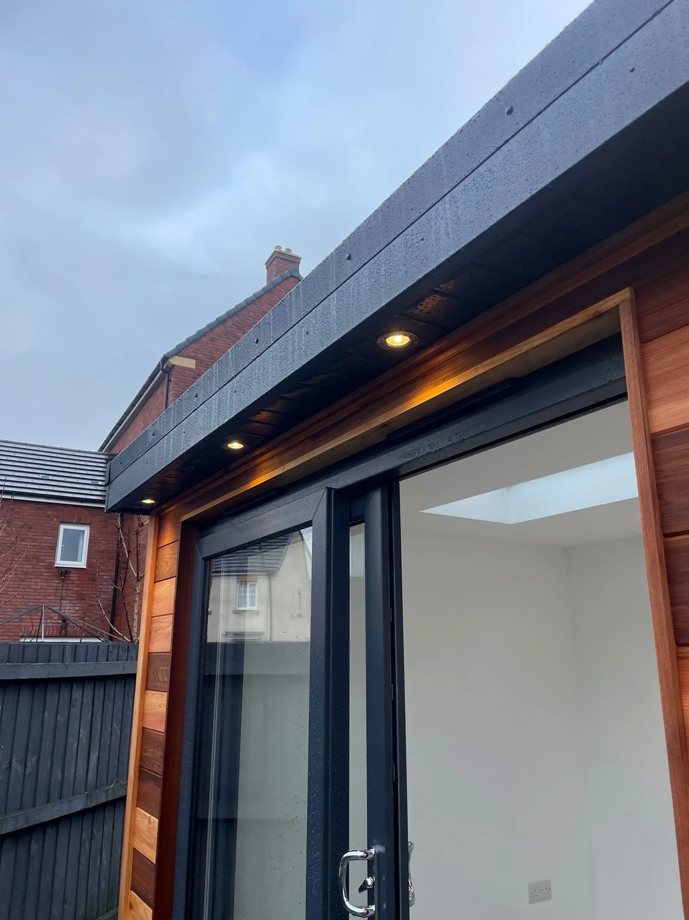  Scenic wooden deck with a sliding door, perfect for outdoor living. 