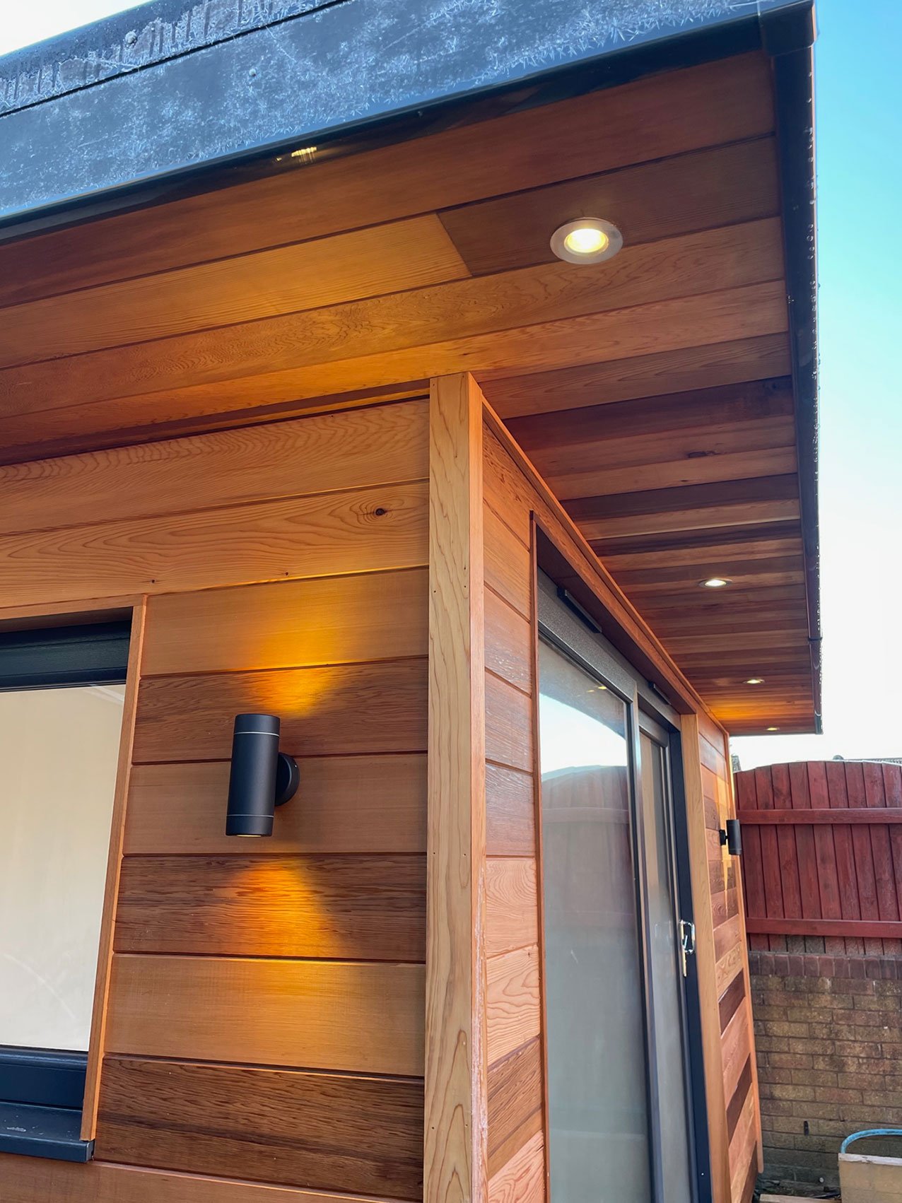  Cozy wooden summerhouse adorned with rooftop lights. 