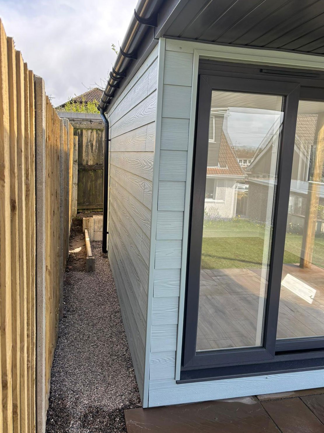 garden-studio-porch-with-blue-composite-cladding.jpg
