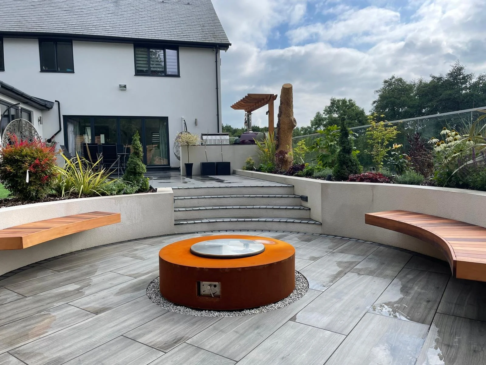 modern-porcelain-patio-with-firepit-contemporary-garden-design.jpeg