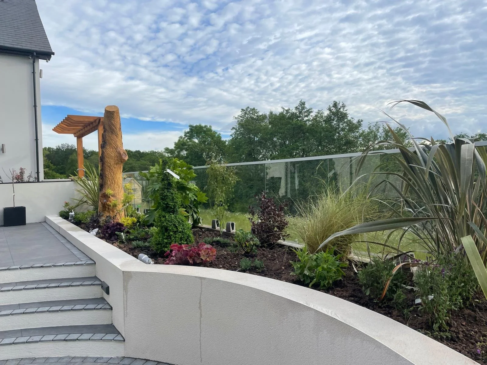 premium-garden-build-with-glass-balustrade-caerphilly-outdoor-space.jpeg