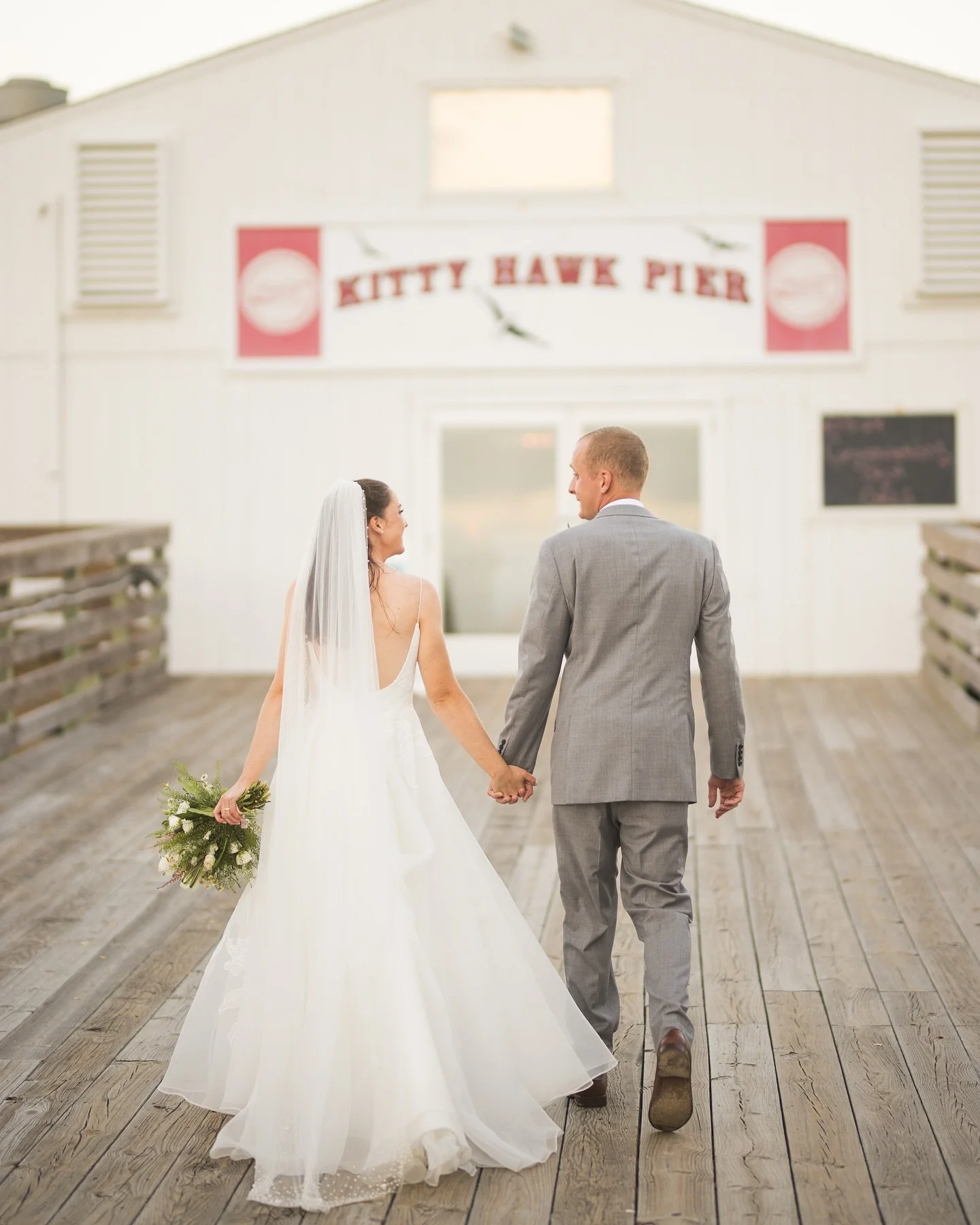 From photographing Erica&rsquo;s cousin&rsquo;s wedding years ago to capturing her beautiful day with Greg at The Kitty Hawk Pier, it&rsquo;s been an incredible journey! 🌅💍 Just as the ceremony ended, a plane banner flew overhead with the sweetest 