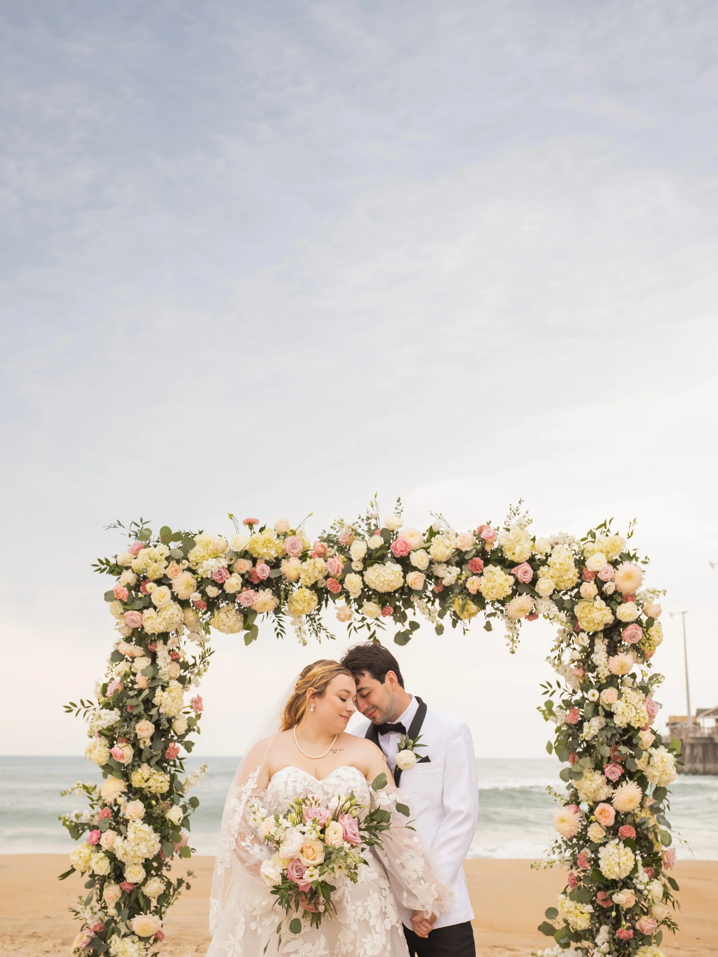 Nick &amp; Max were an absolute rad duo to photograph as they celebrated their wedding day at Jennette&rsquo;s Pier in the Outer Banks. The day carried an almost cinematic energy, with ominous skies rolling in from the coast all afternoon, yet someho