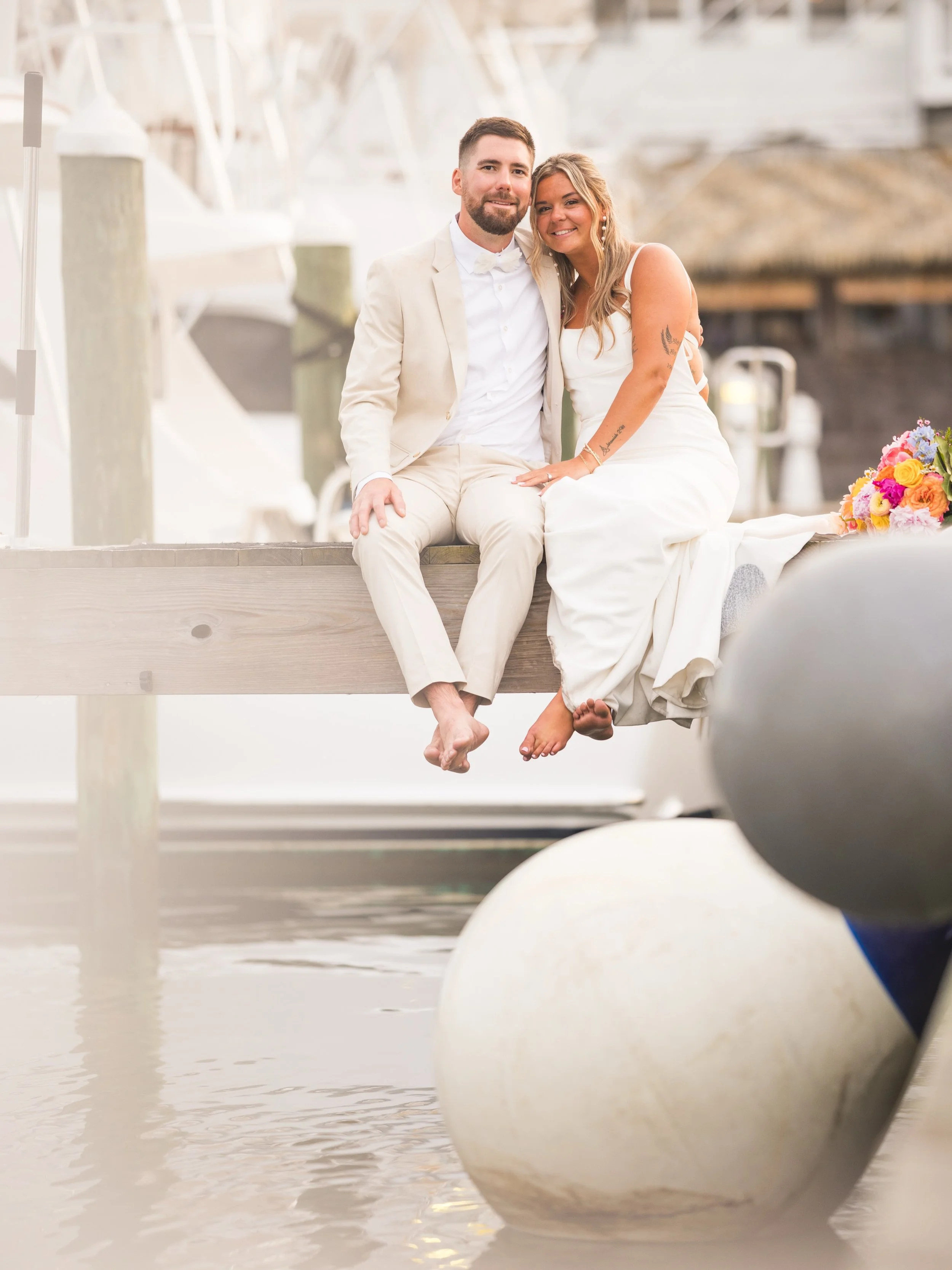 Grace &amp; Bryce&rsquo;s wedding day at the beautiful Pirates Cove Pavilion in Manteo, NC felt like something out of a dream ✨ Surrounded by luxury fishing boats and the charm of an upscale marina, they said &ldquo;I do&rdquo; with the most stunning