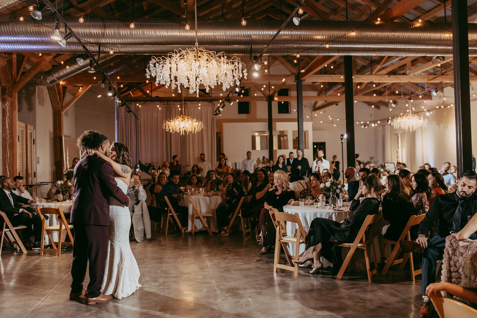 Guests gather in our expansive 12,000-square-foot ballroom to witness the first dance under a canopy of glowing string lights. As the premier Chico wedding reception venue, The Westport offers a grand yet intimate atmosphere where every loved one has