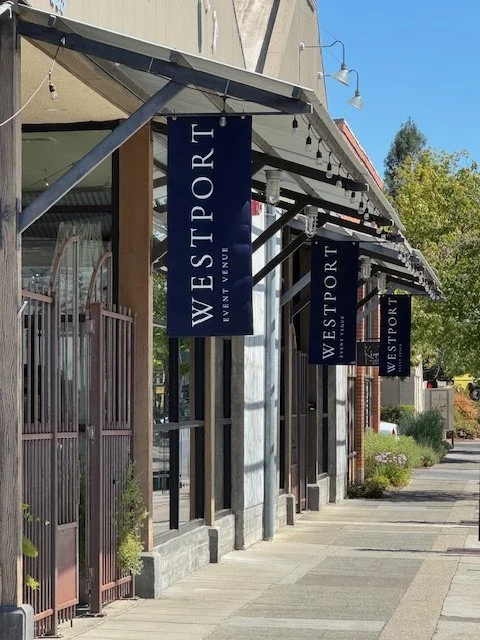 The Westport banners hanging outside the Nantucket builidng at the westport in downtown Chico
