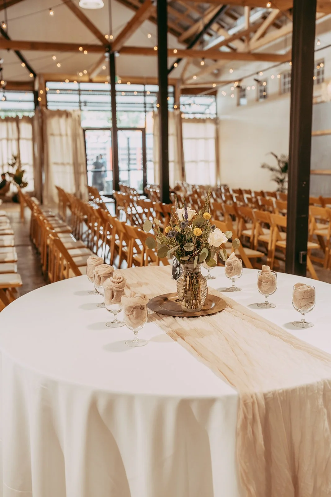 Host a breathtaking wedding ceremony in our expansive Chico ballroom. Featuring historic walnut-shell blasted wood beams and glowing bistro string lights, The Westport offers a stunning industrial backdrop with our signature vintage tin barn door, lo