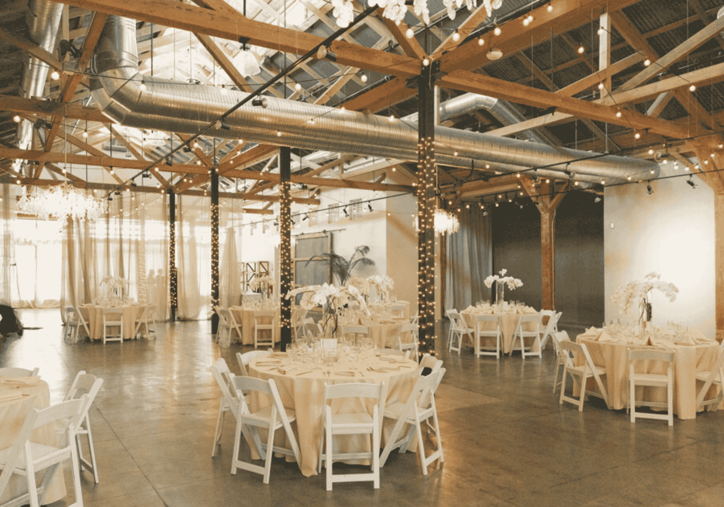 The Ballroom at the Westport in downtown Chico setup for a wedding under its historic wood beams