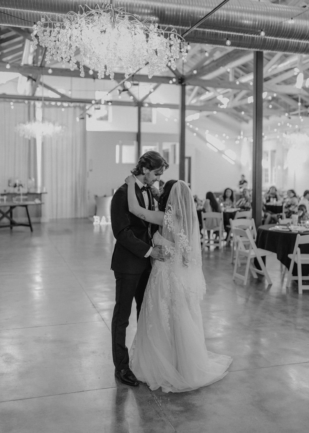Bride and groom dancing their wedding first dance in the ballroom at the Westport in downtown Chico