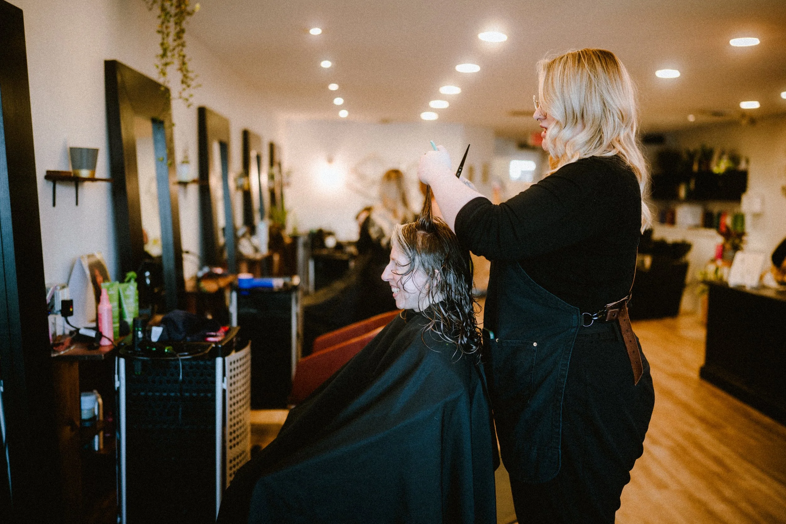 Woman getting a specialized curly hair cut