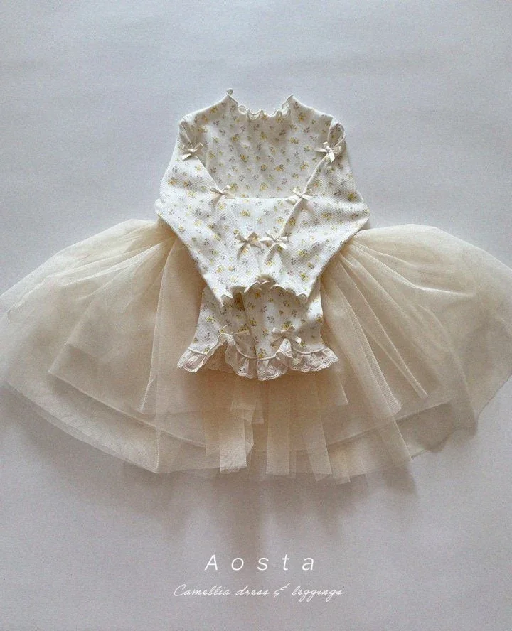 yellow dress and leggings.webp