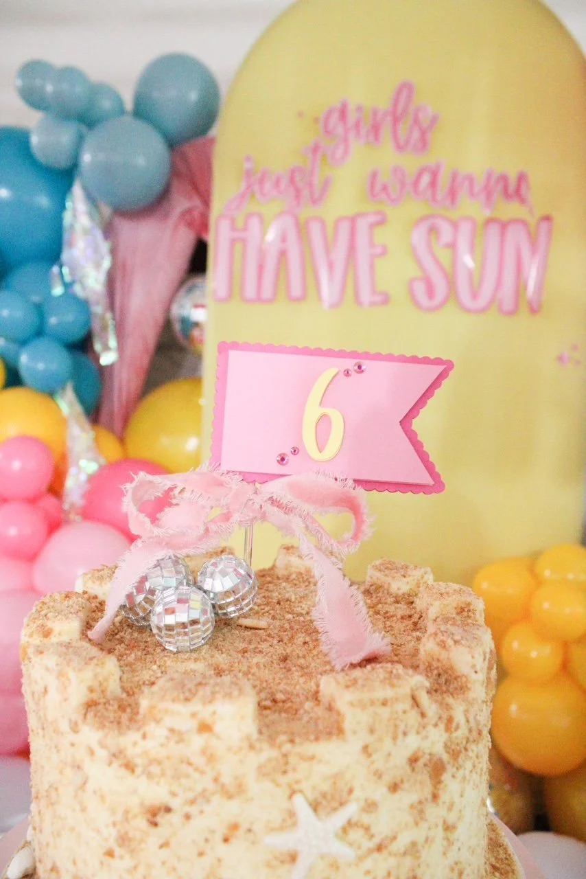 custom flag cake topper on sandcastle summer birthday cake