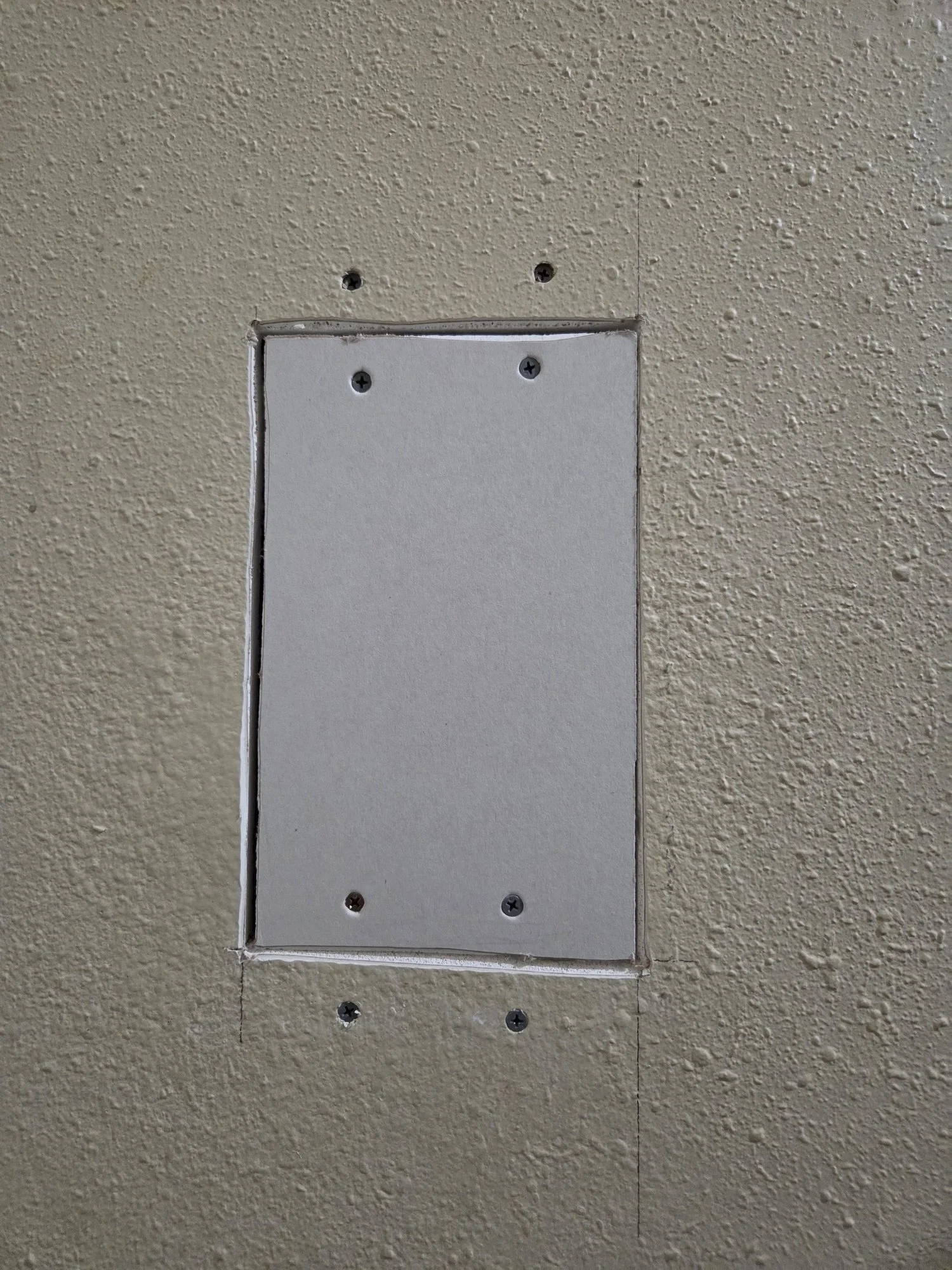 drywall hole repair patched with new drywall