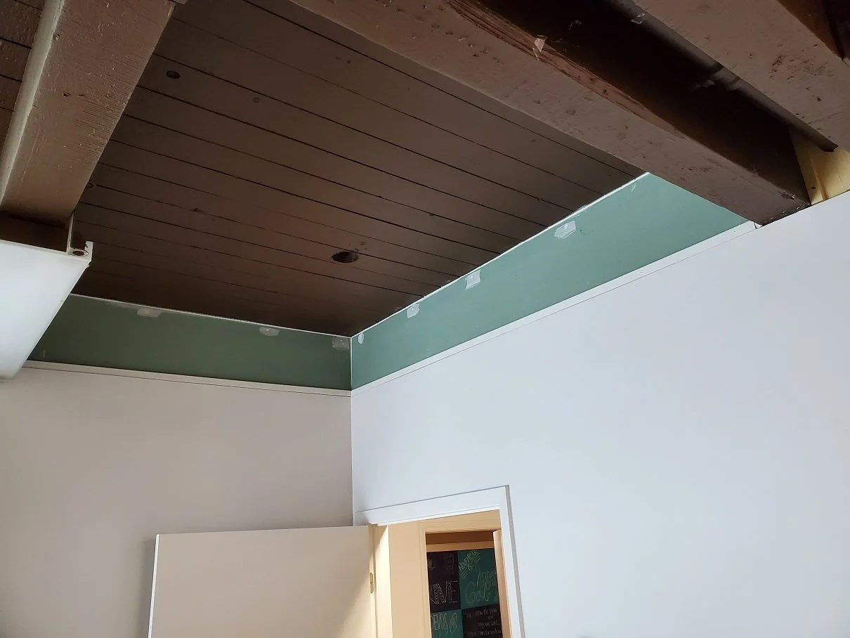 wood beam ceiling in home before painting