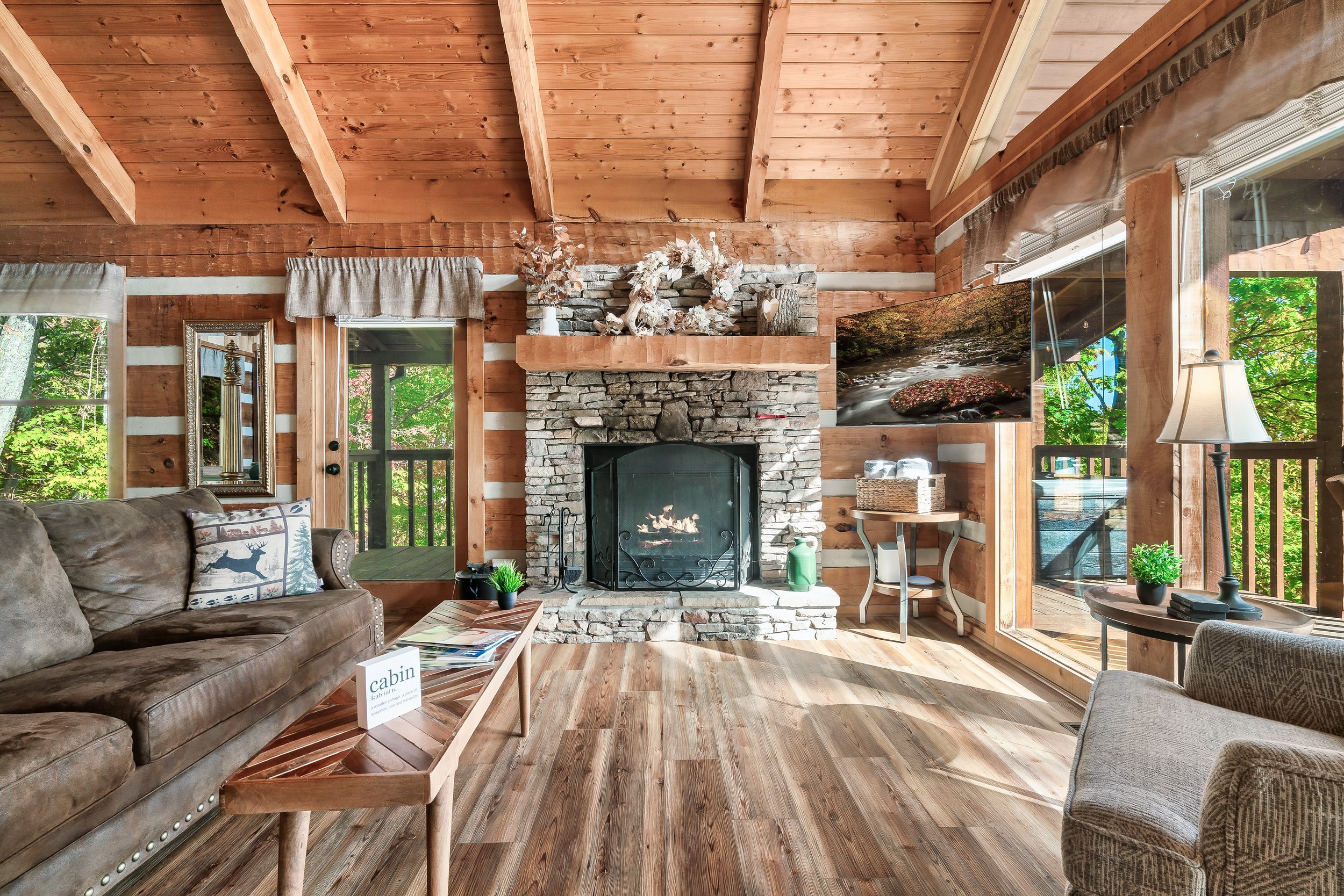 Your own wood-burning fireplace crackles with life, its warm glow and comforting scent infusing the room with a cozy ambiance, becoming the heart of your home's comfort.