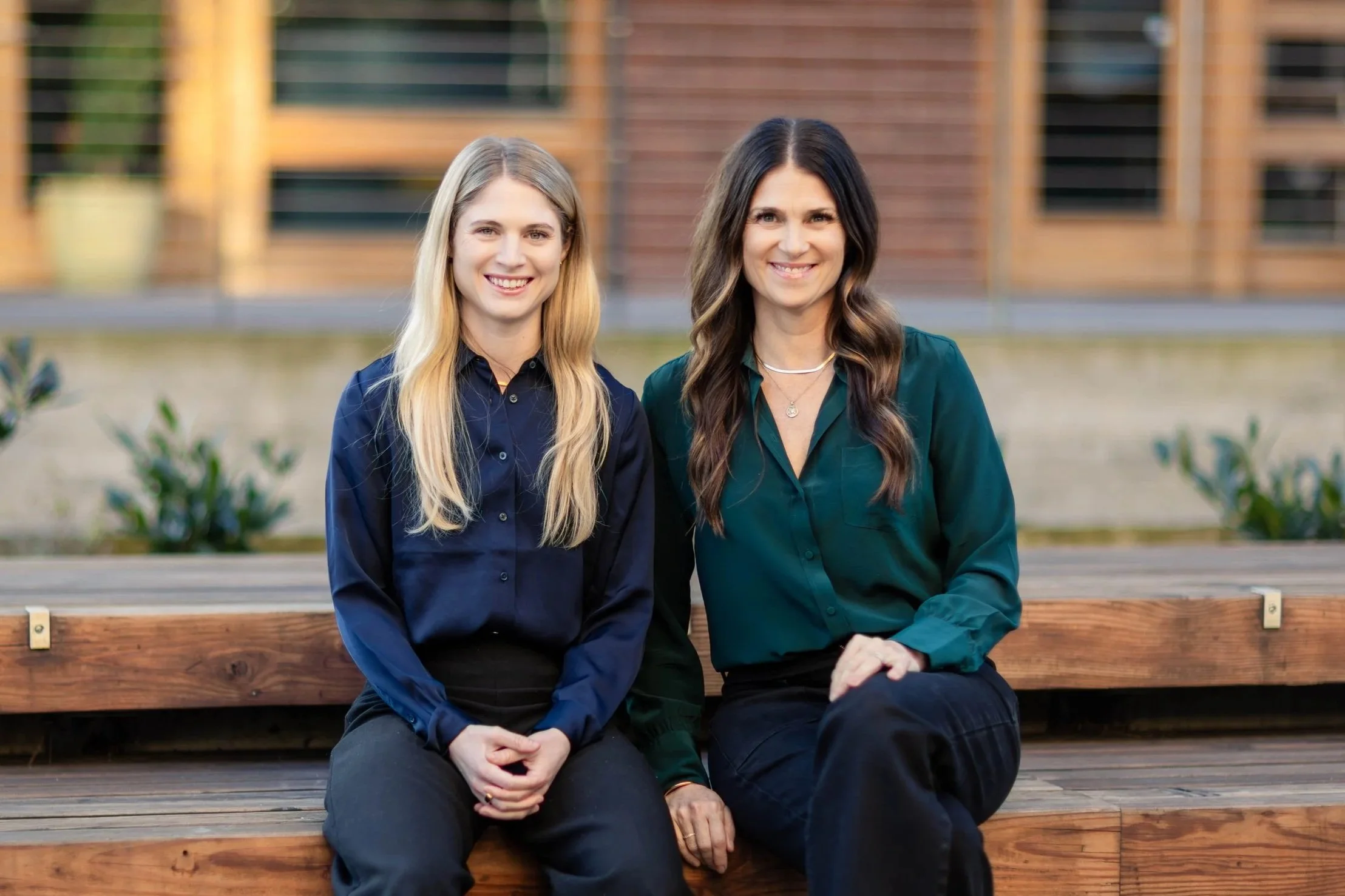 A healthcare professional examining a patient lying on a medical bed.