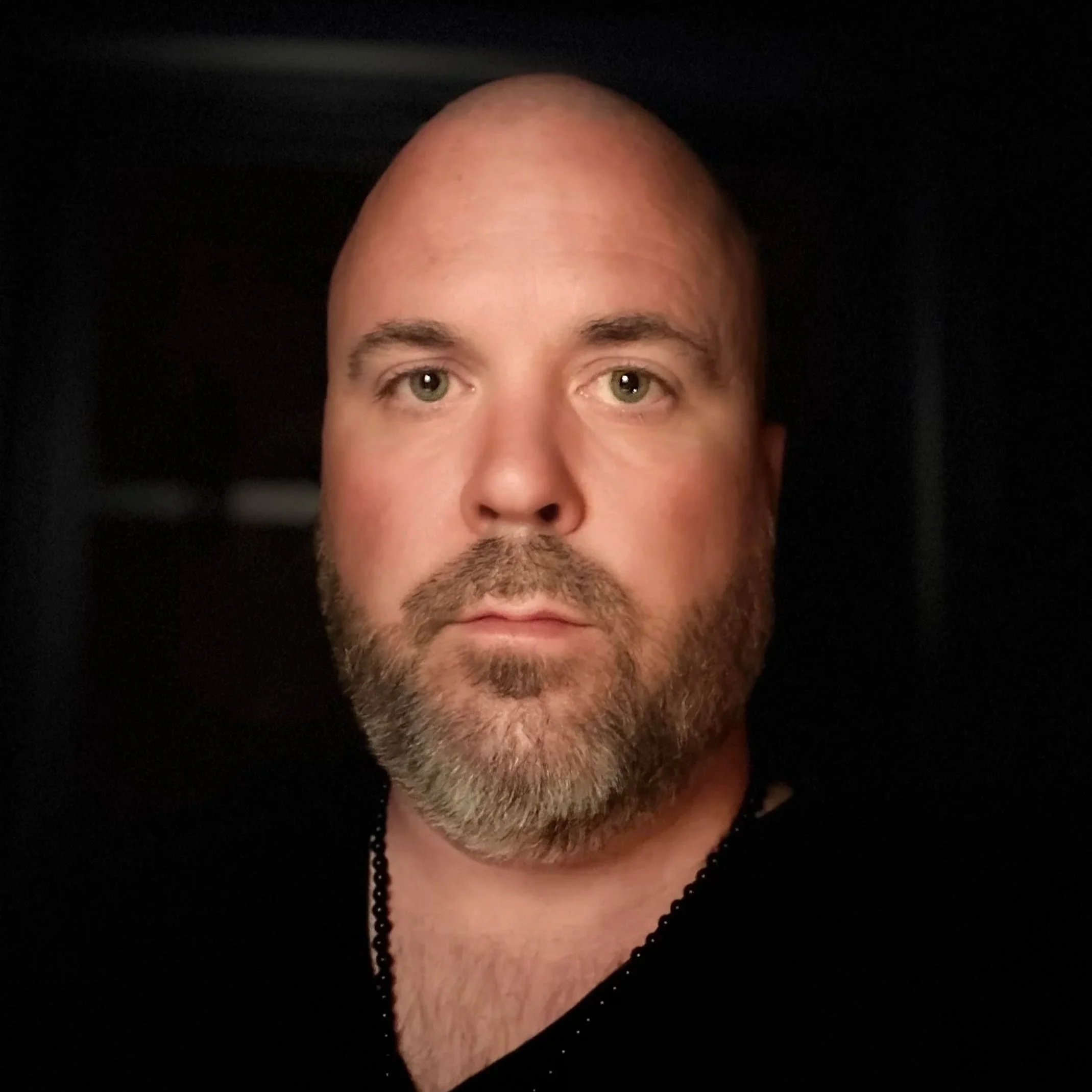 Headshot of Brandon Lloyd, founder of reSpark KC, looking directly at the camera against a dark background.