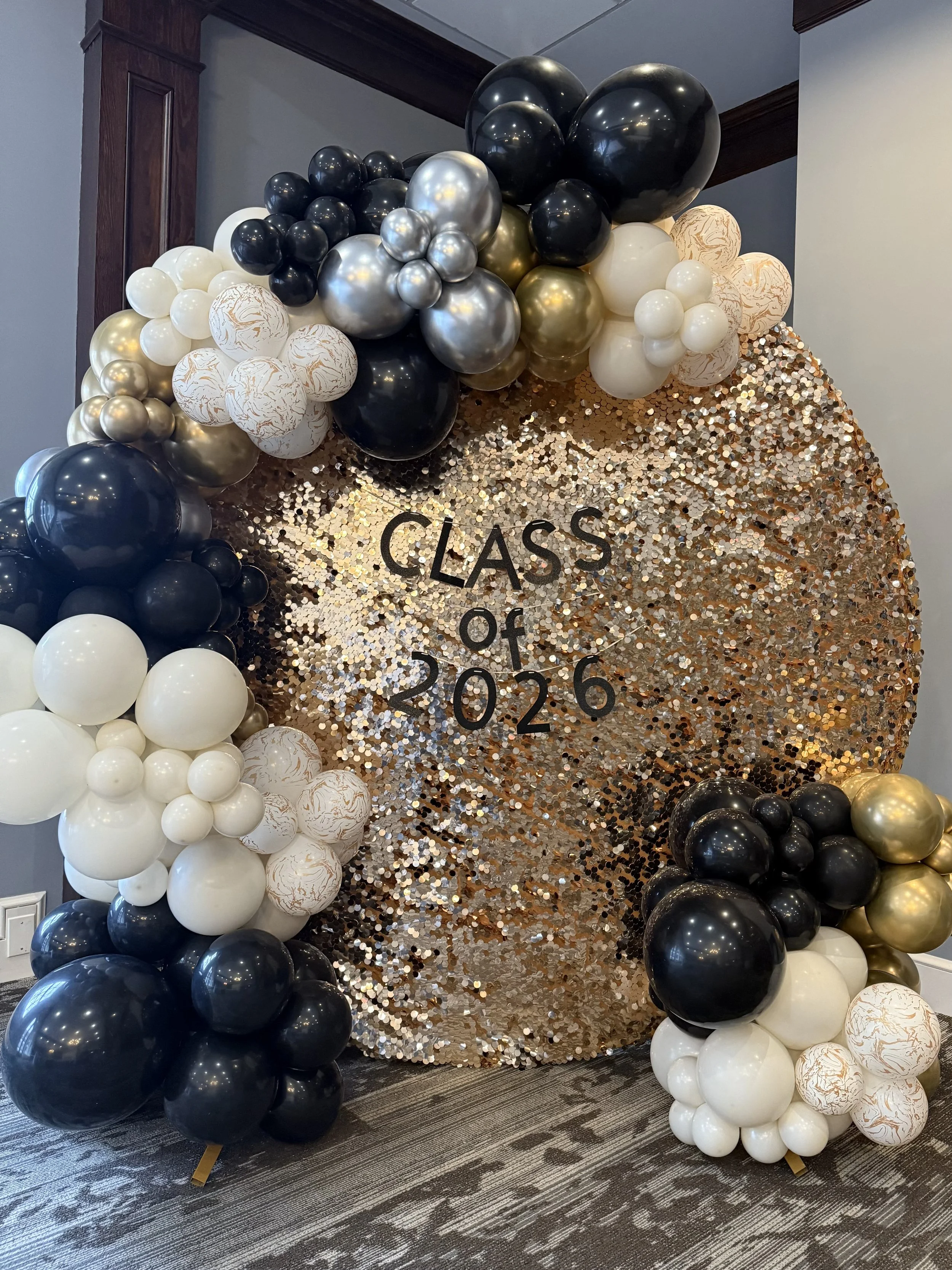 gold sequin hoop with black, white, and gold balloons