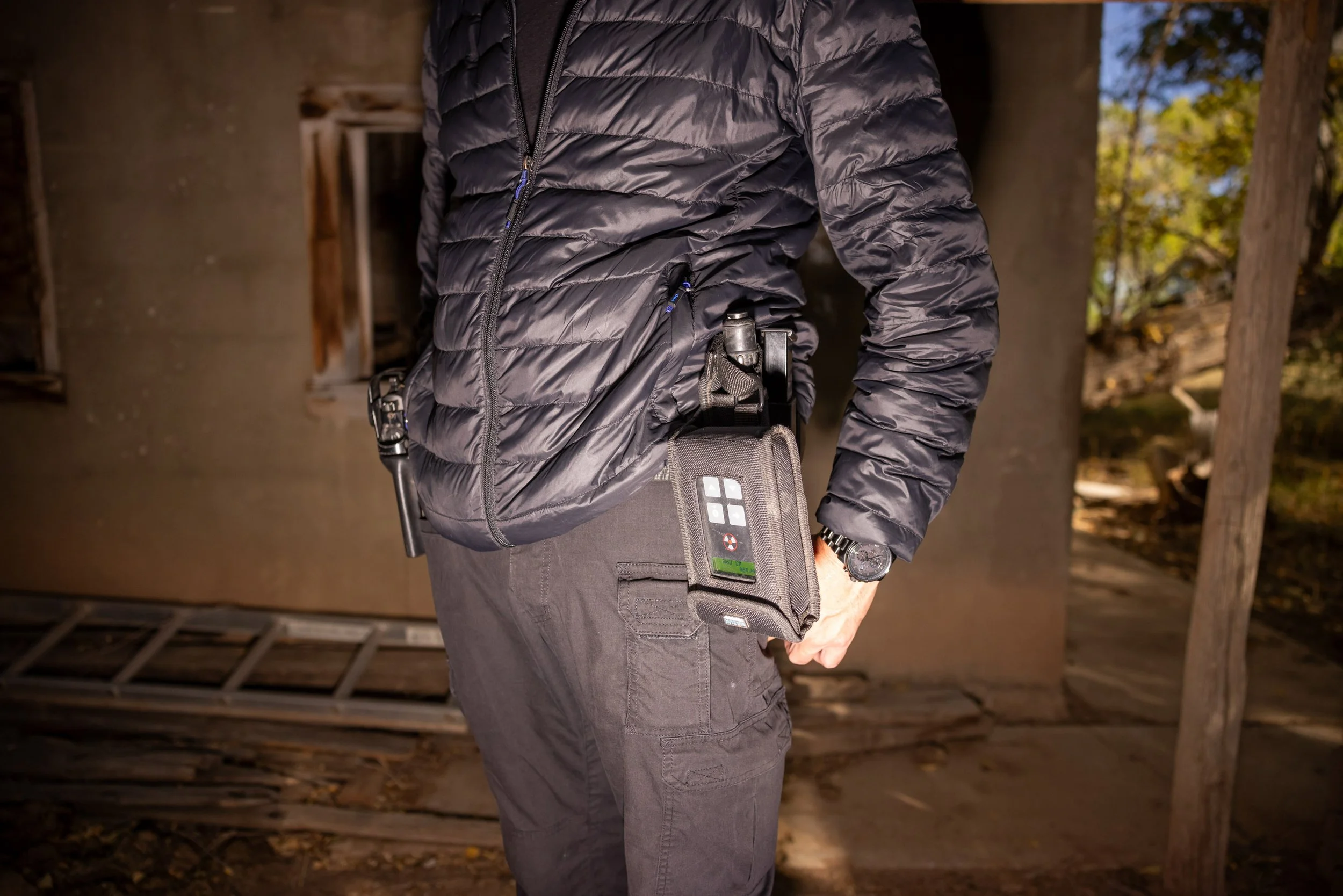 Bryant "Dragon" Arnold, head of security at Skinwalker Ranch, carries a handgun and a geiger counter.