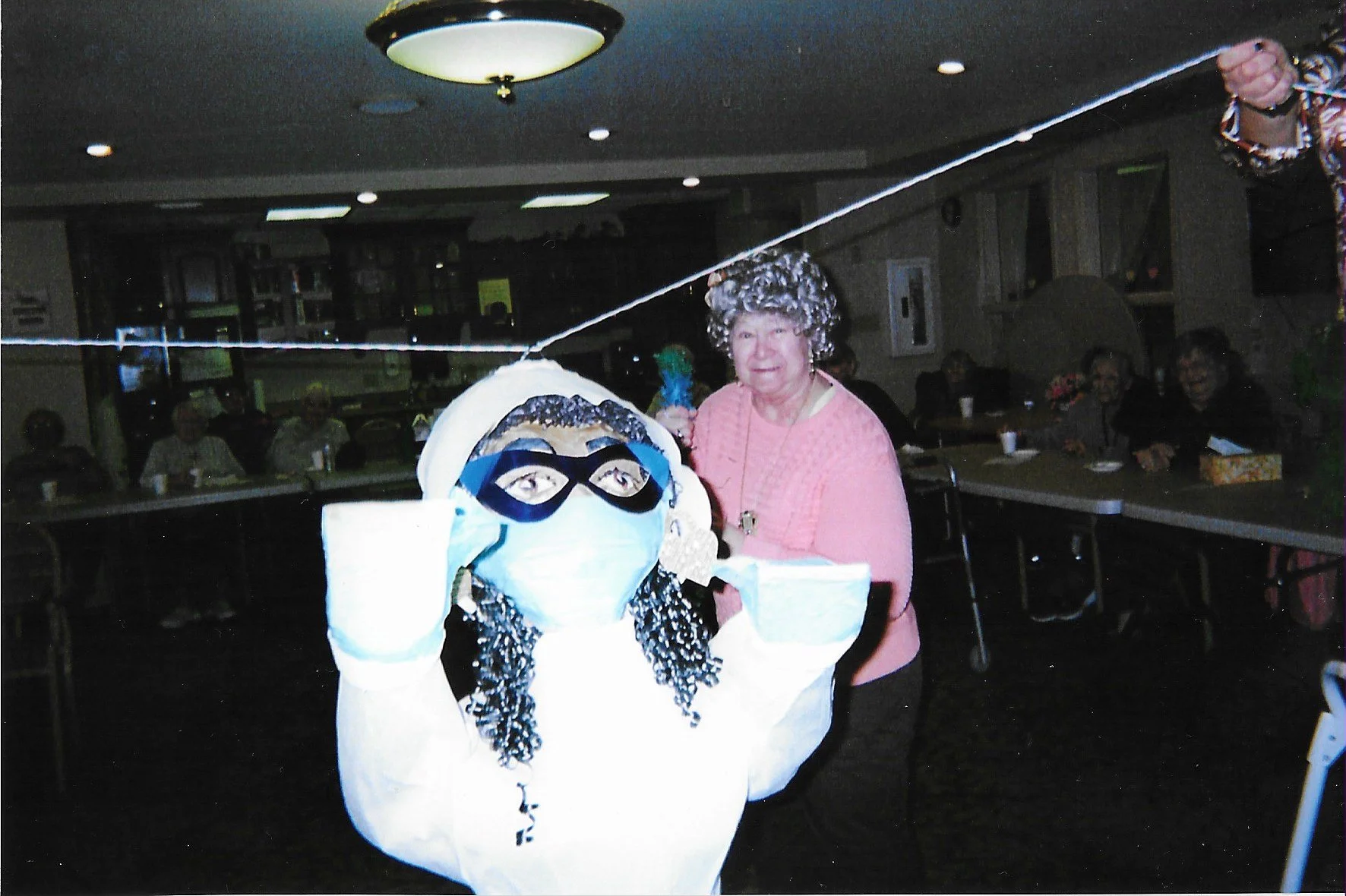 Cristy: Superhero (Grace Village Breaking Ceremony), Cardboard, papier-mâché (newspaper), tissue paper, crepe paper, and rope, 2025

--This piñata honors Cristy, Karla’s mother, who served as an Activity Leader at Grace Village nursing home during th