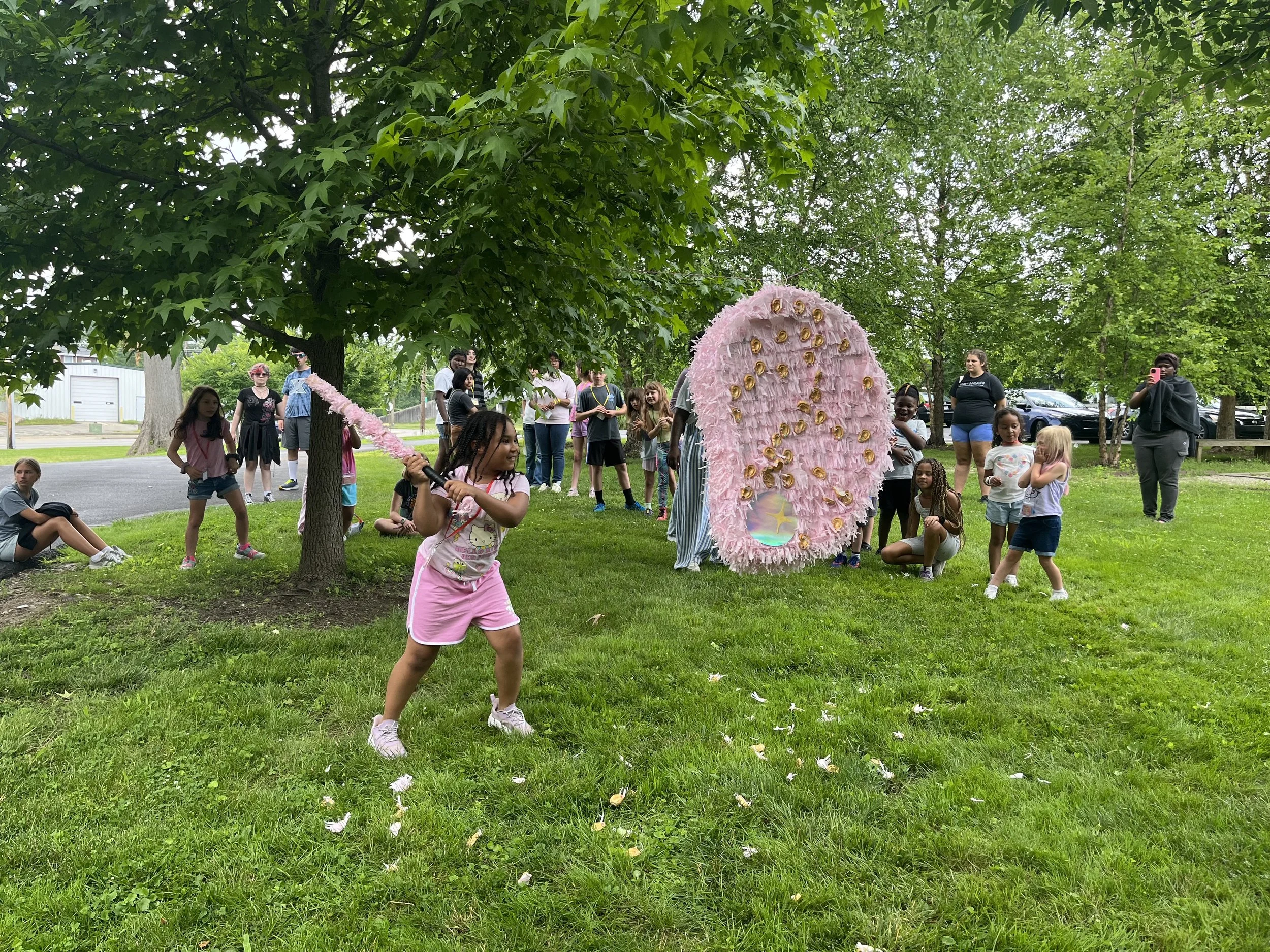 Milagros Para Mi Nieta 2 (Kennedy Heights Arts Center Breaking Ceremony), Tissue paper, cardboard, papier-mâché (newspaper), rope, and sticker earrings, 2025

--Milagros Para Mi Nieta consists of a pair of ear-shaped piñatas layered with smaller papi