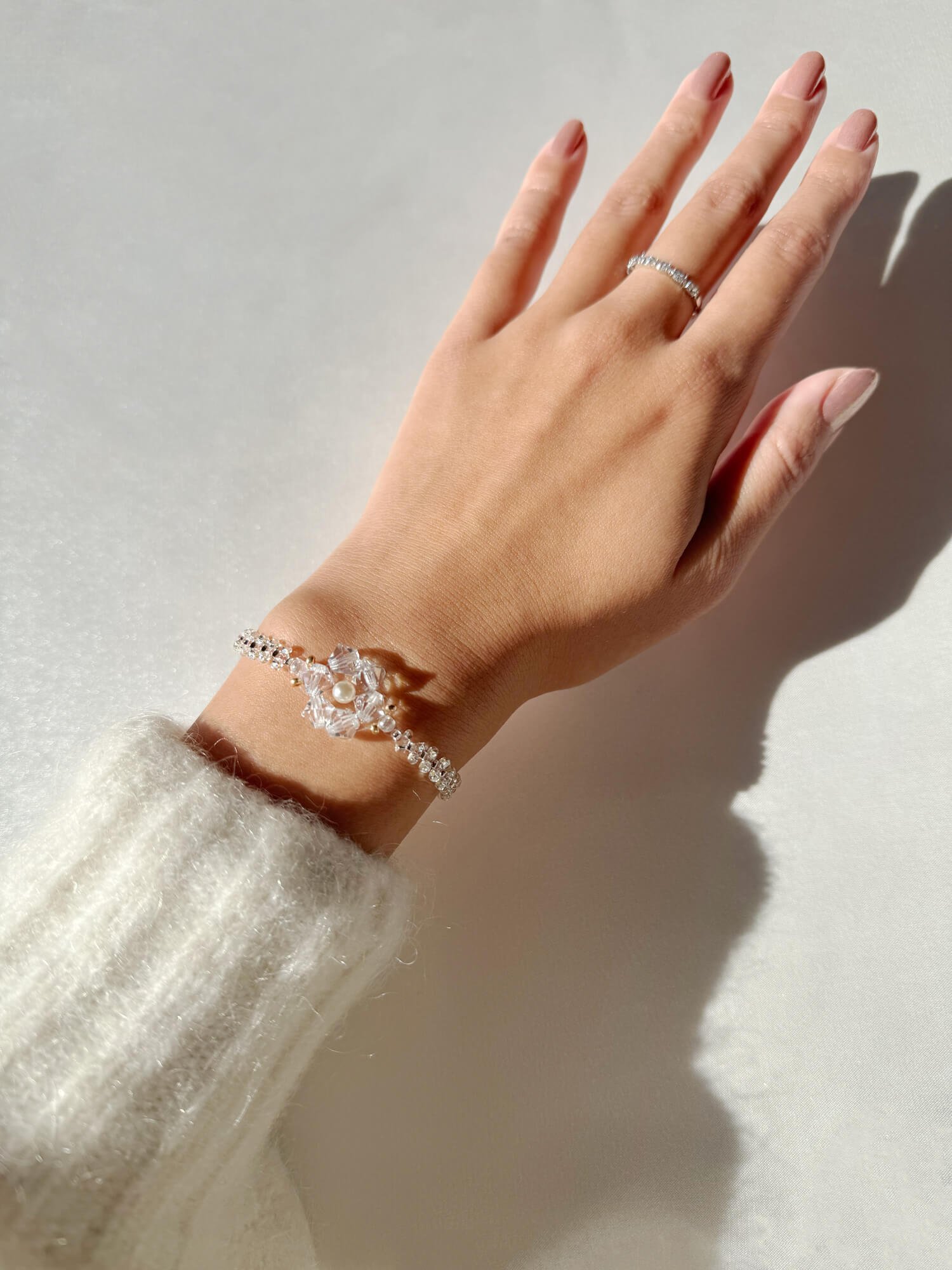 reminisse-secca-snowflake-bracelet-model-wearing.jpg