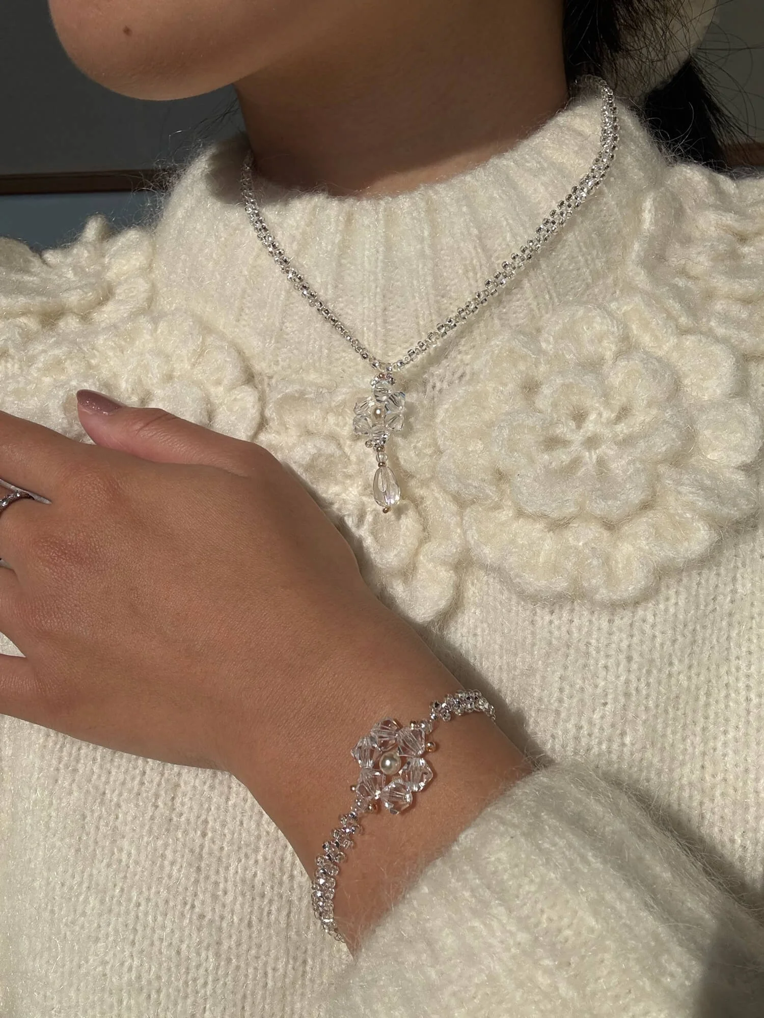 reminisse-secca-snowflake-holiday-collection-bracelet-and-necklace-worn-together.jpg