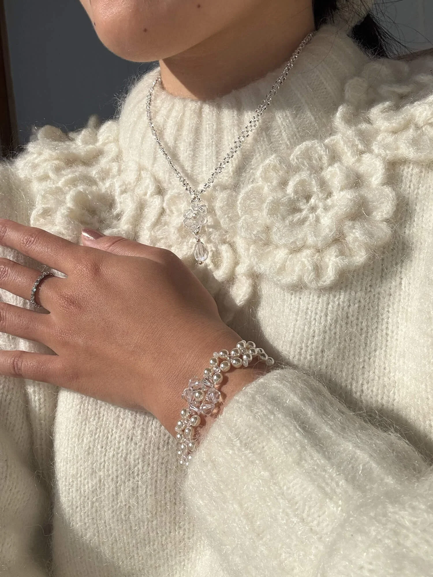 reminisse-secca-holiday-collection-pearl-bracelet-and-snowflake-necklace-worn-together.jpg