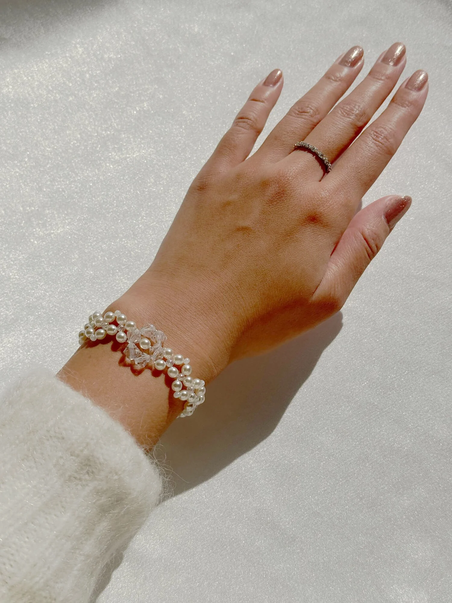 reminisse-pearl-bracelet-secca-holiday-collection-on-wrist.jpg
