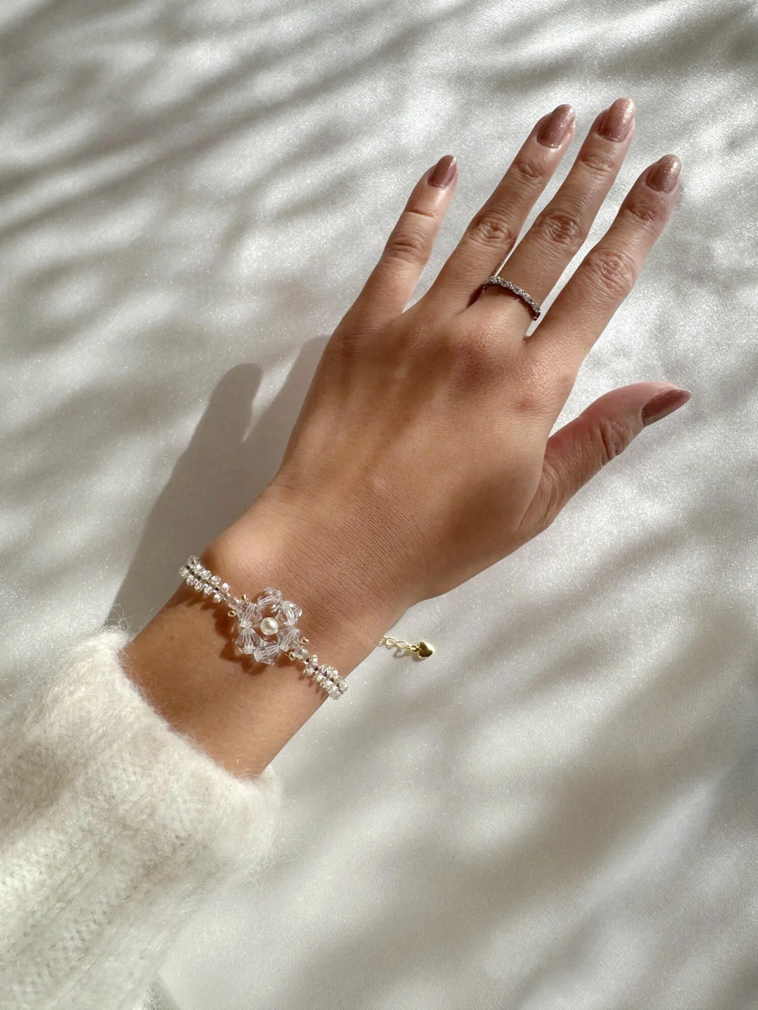 reminisse-secca-snowflake-bracelet-on-model.jpg