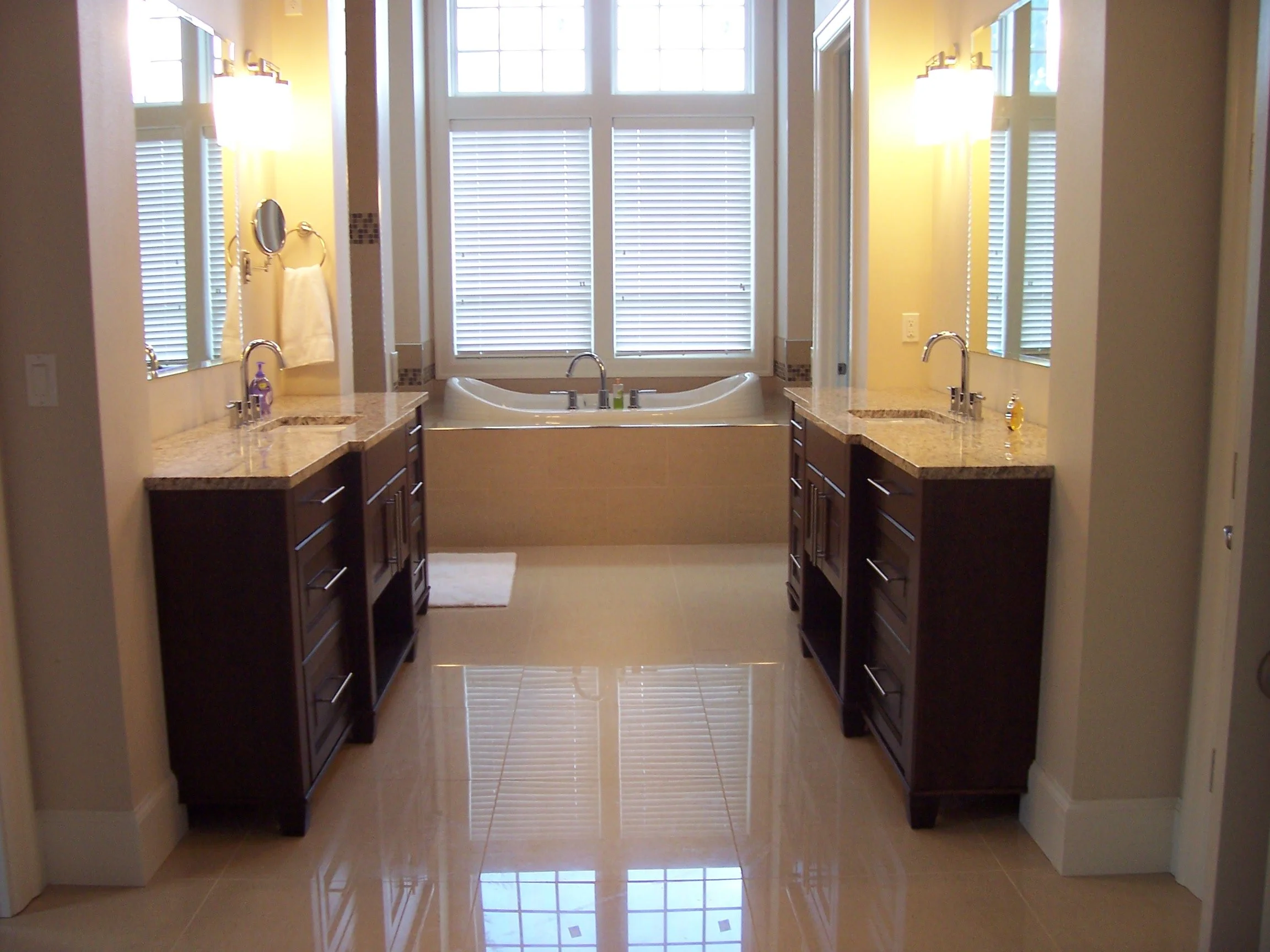 Luxury bathroom with double sinks, granite countertops