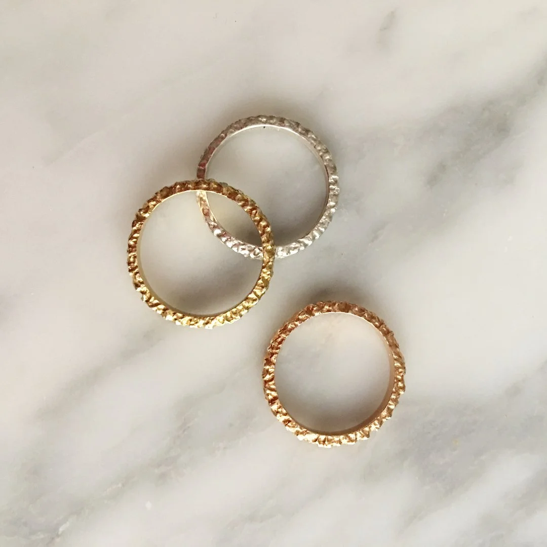 Gold, rose, and silver rings.