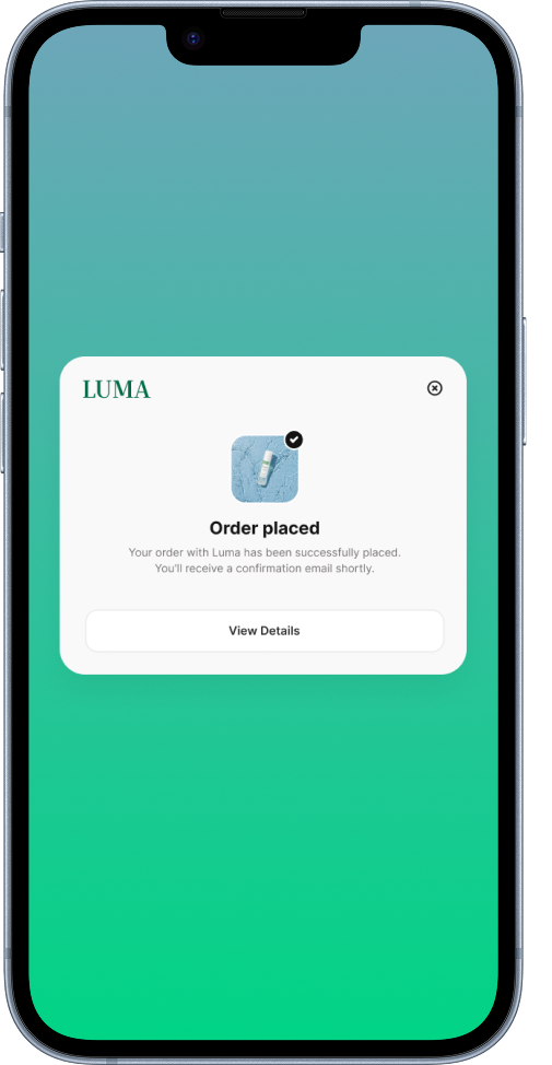 Smartphone screen displaying a confirmation message for a successfully placed order with an app logo for Luma, featuring a small image of a medication or supplement bottle.