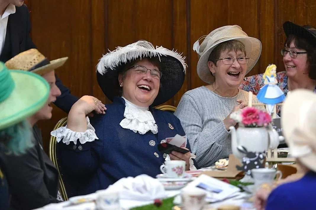 Guests in costume smiling at a private celebration
